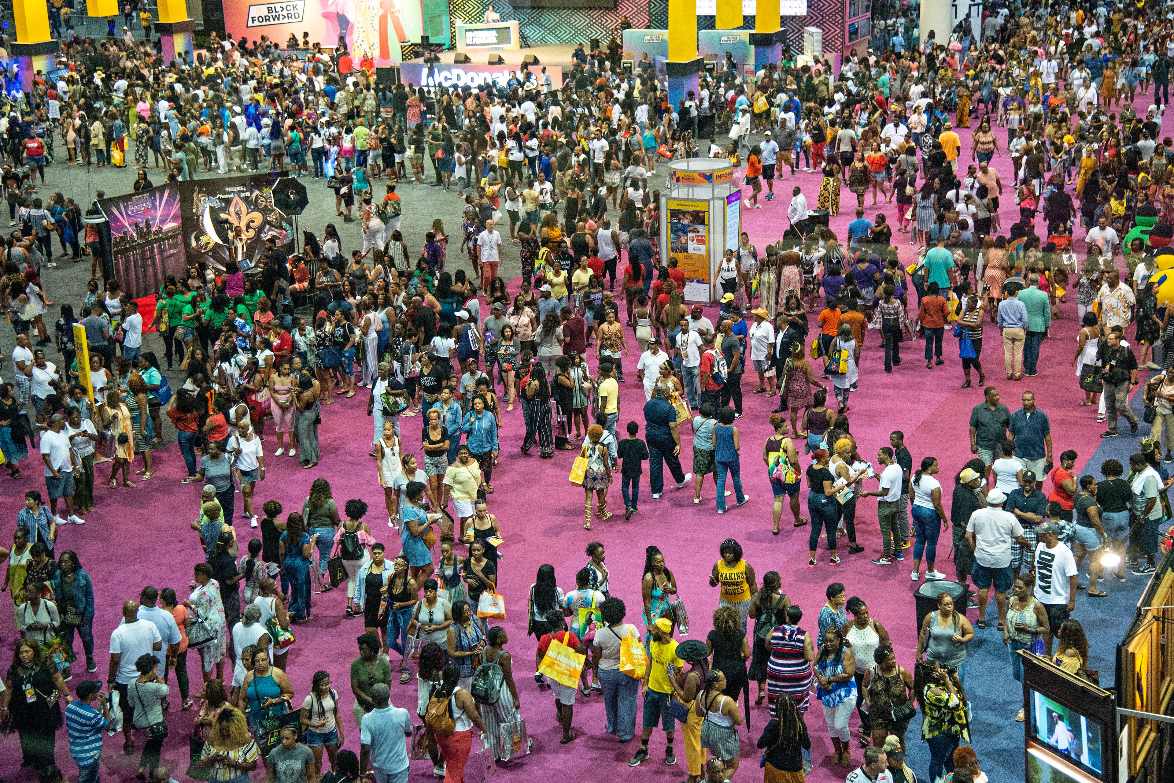 FILE - Attendees walk around the 2018 Essence Festival at the Ernest N. Morial Convention Center on Friday, July 6, 2018, in New Orleans. The 30th Essence Festival of Culture, celebrating the best of Black culture’s policymakers, thought leaders, creatives, business minds, health experts and musical talent, will take place this Fourth of July weekend, 2024, in New Orleans. (Photo by Amy Harris/Invision/AP, File)