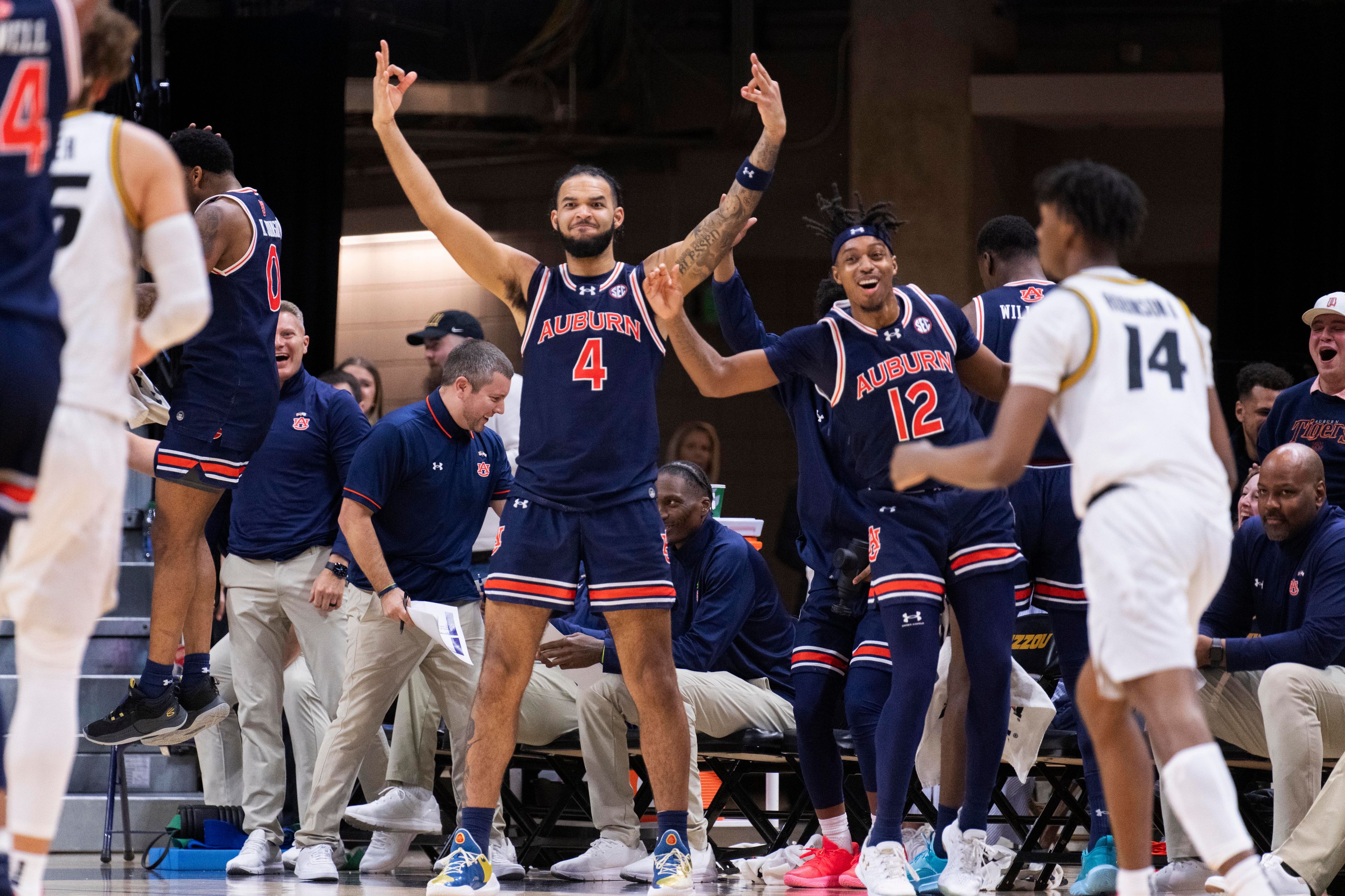 Auburn's Johni Broome (4) and Denver Jones (12) celebrate a basket late during the second half of the team's NCAA college basketball game against Missouri on Tuesday, March 5, 2024, in Columbia, Mo. (AP Photo/L.G. Patterson)