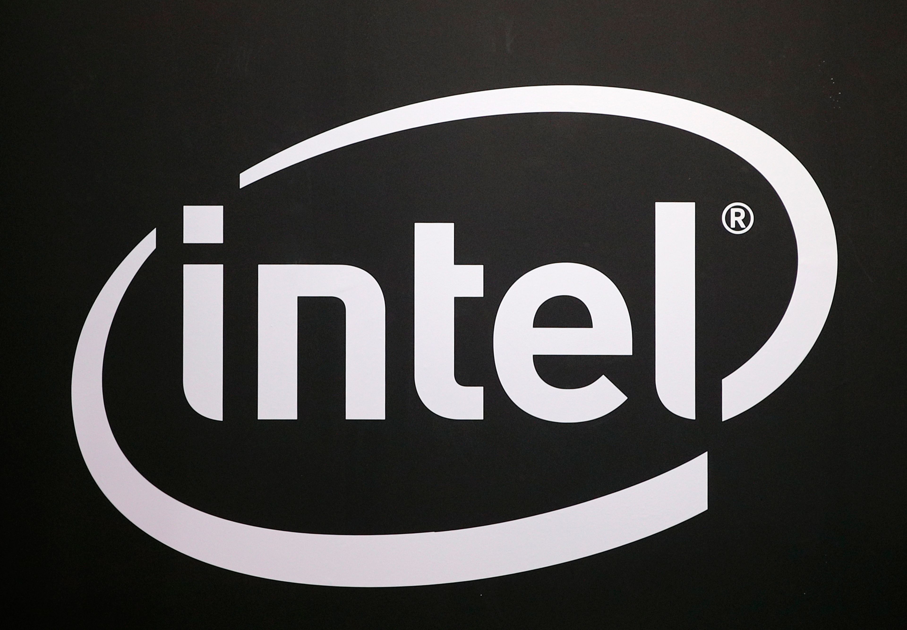 FILE -The logo of semiconductor chip maker Intel is pictured at the Paris games week in Paris, Nov. 4, 2017. (AP Photo/Christophe Ena, File)