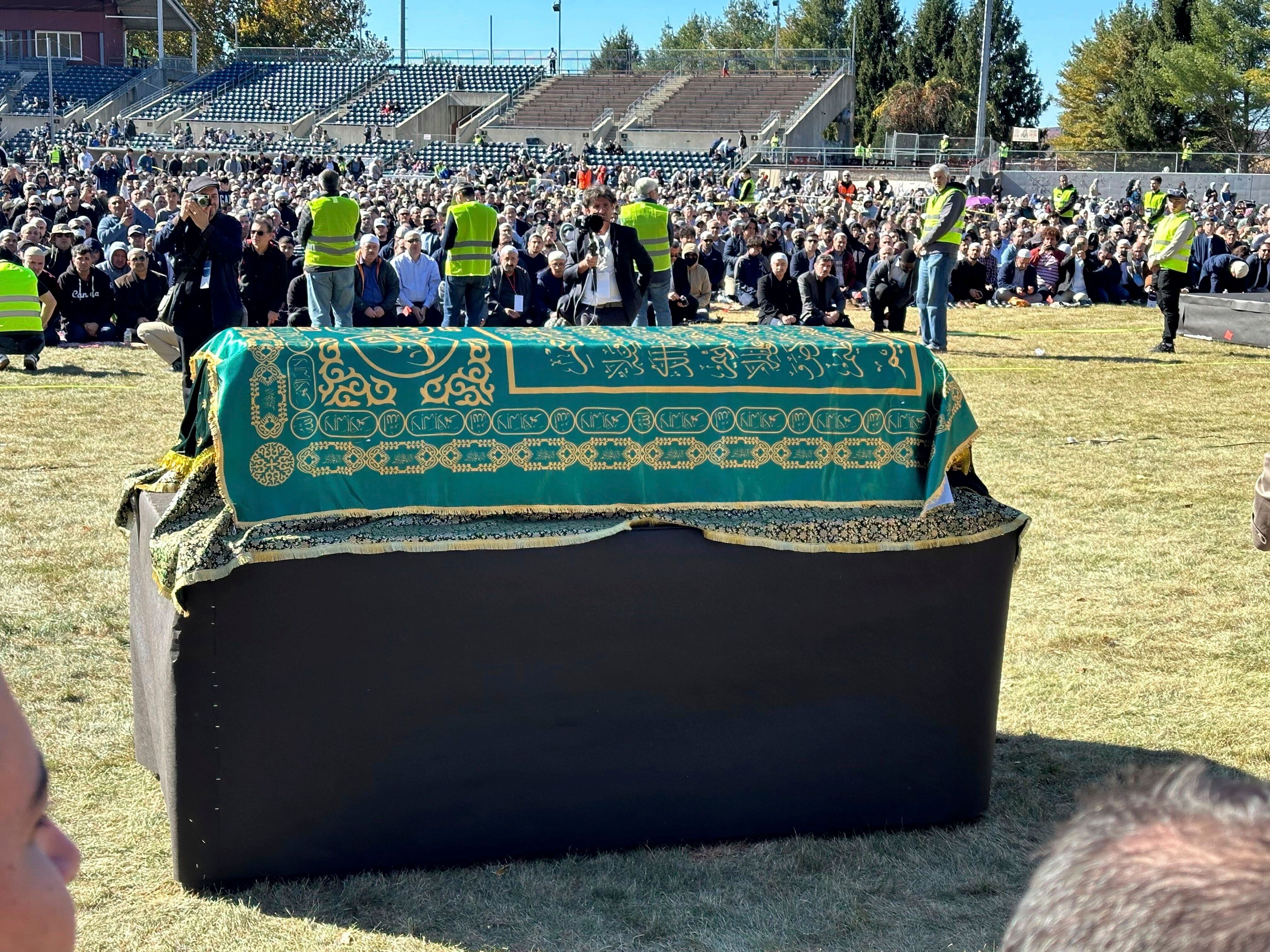 A casket bearing the body of Fethullah Gülen, a Muslim cleric living in exile in the United States and faced unproven allegations that he orchestrated a failed 2016 coup in Turkey, sits in Skylands Stadium in Augusta, New Jersey, where thousands gathered for funeral prayers on Thursday Oct. 24. 2024. (AP Photo/Mike Rubinkam)