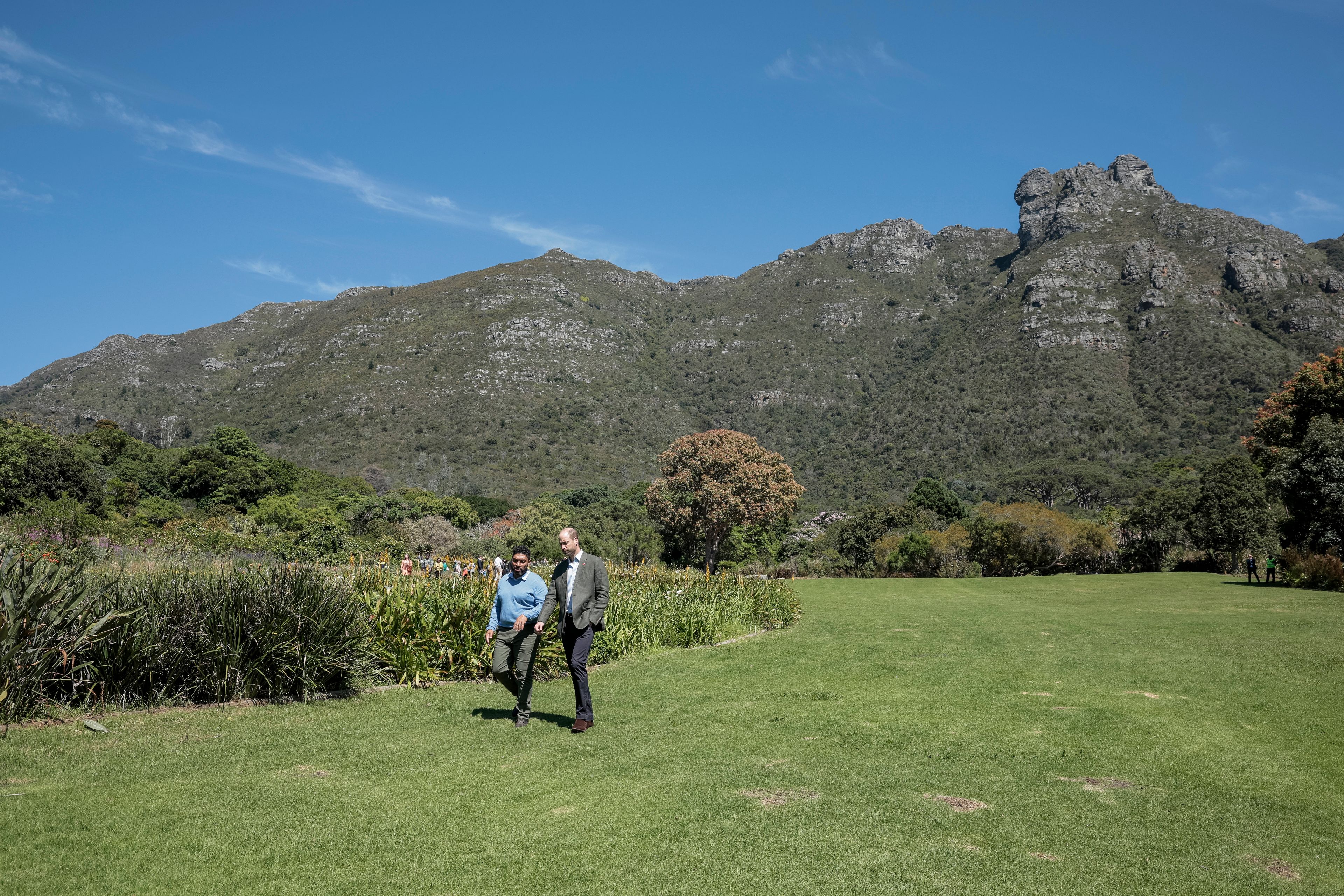 Britain's Prince William, Prince of Wales, center right, walks with Garden Director Werner Voigt before a meeting with the 2024 Earthshot Prize Finalists, at Kirstenbosch National Botanical Garden in Cape Town, South Africa, Wednesday, Nov. 6, 2024. (Gianluigi Guercia, Pool Photo via AP)