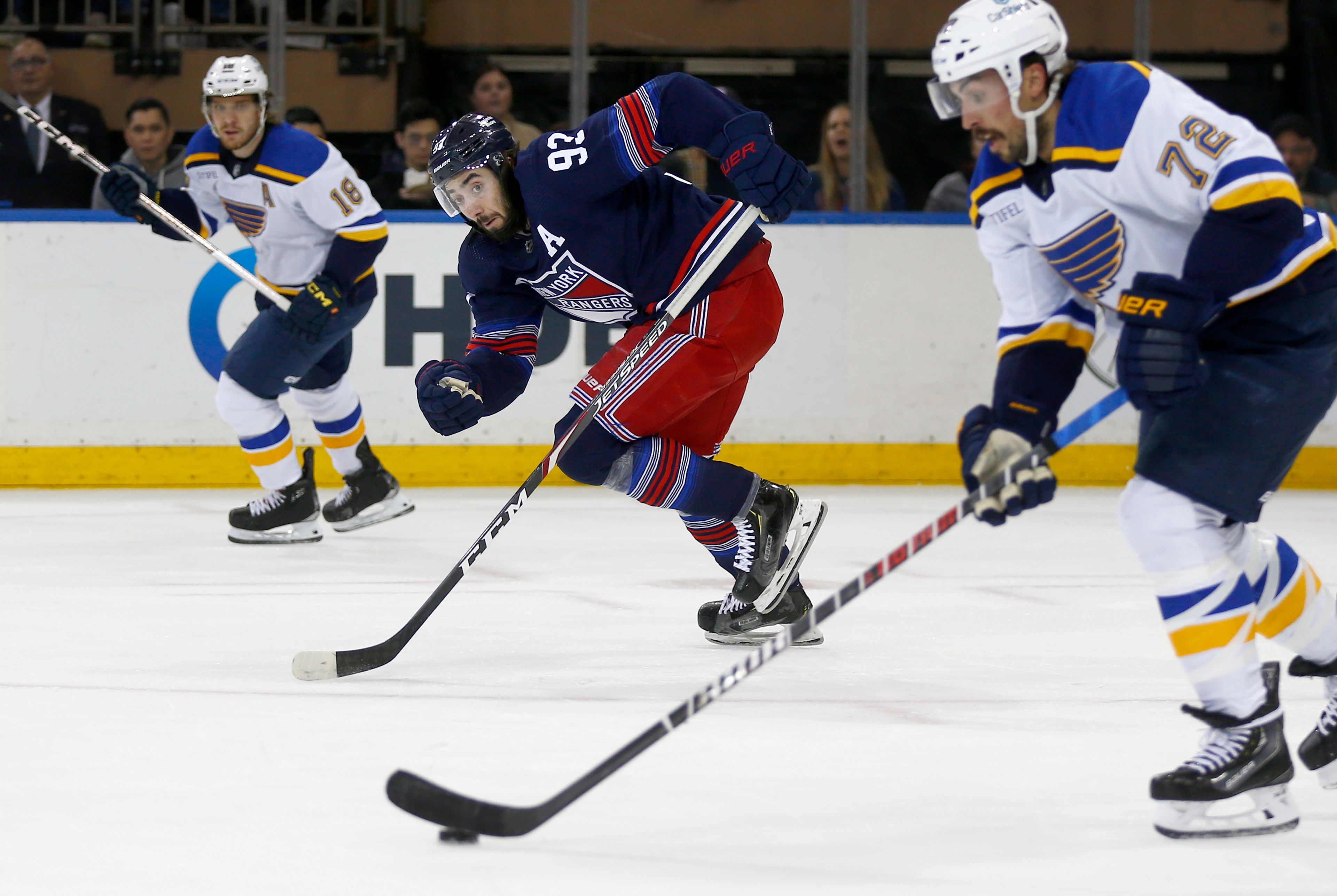 New York Rangers center Mika Zibanejad (93) watches St. Louis Blues defenseman Justin Faulk (72) during the first period of an NHL hockey game Saturday, March 9, 2024, in New York. (AP Photo/John Munson)