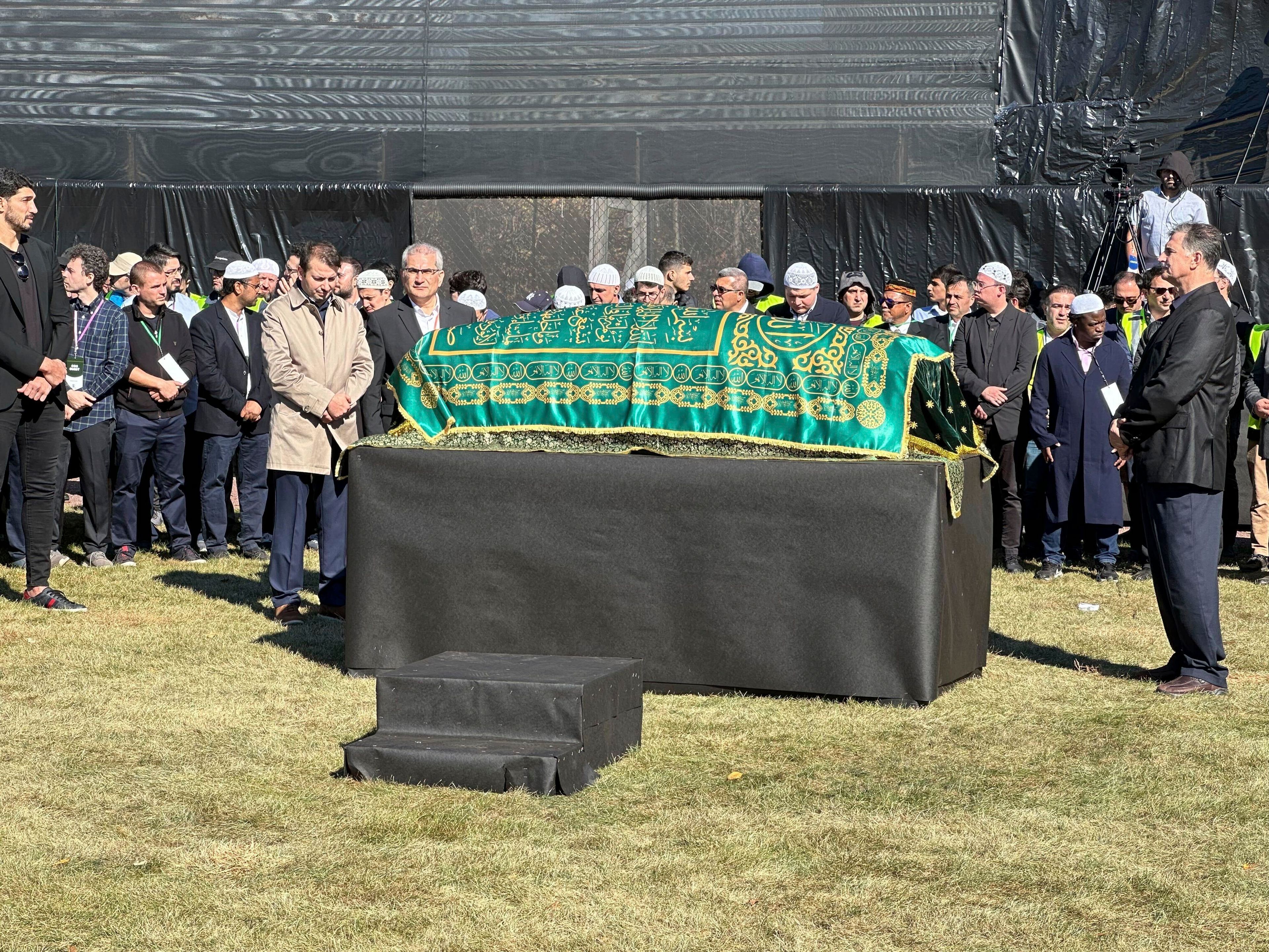 A casket bearing the body of Fethullah Gülen, a Muslim cleric living in exile in the United States and faced unproven allegations that he orchestrated a failed 2016 coup in Turkey, sits in Skylands Stadium in Augusta, N.J., where thousands gathered for funeral prayers on Thursday Oct. 24. 2024. (AP Photo/Mike Rubinkam)