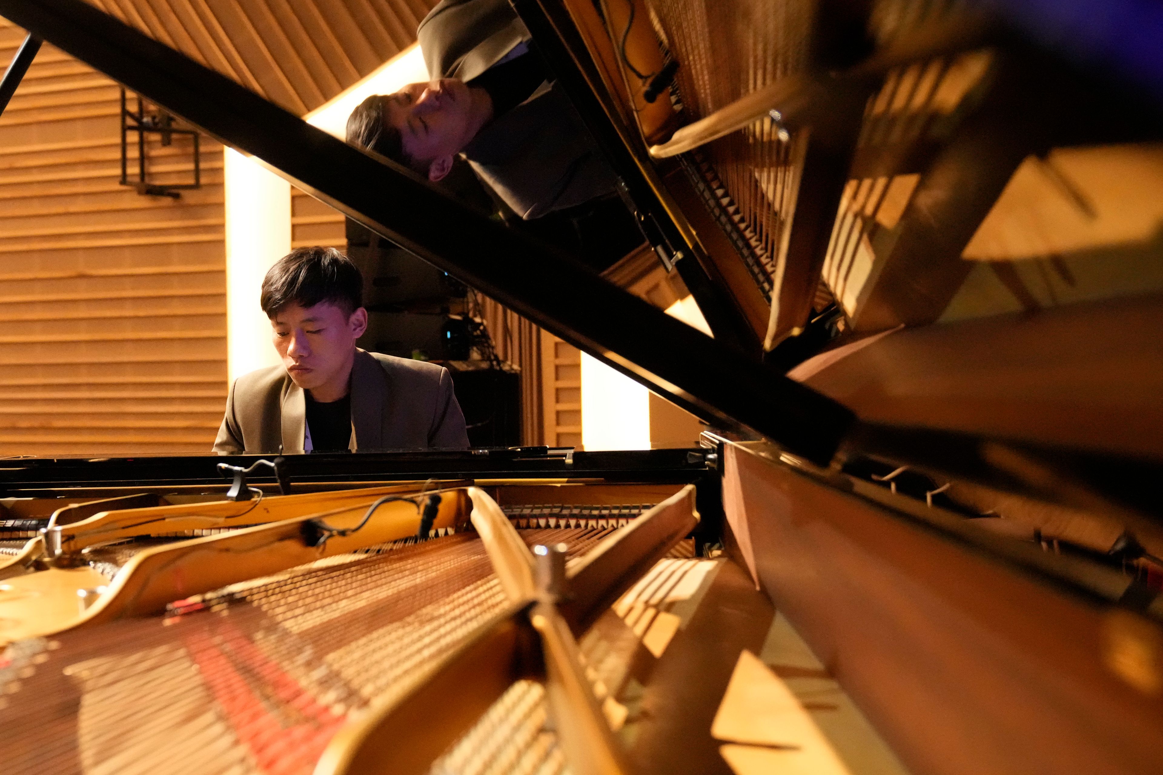 Takosangba Pongen, 27, a blind pianist, rehearses during the two-day Brillante Piano Festival in Bengaluru, India, Sunday, Sept. 29, 2024. (AP Photo/Aijaz Rahi)