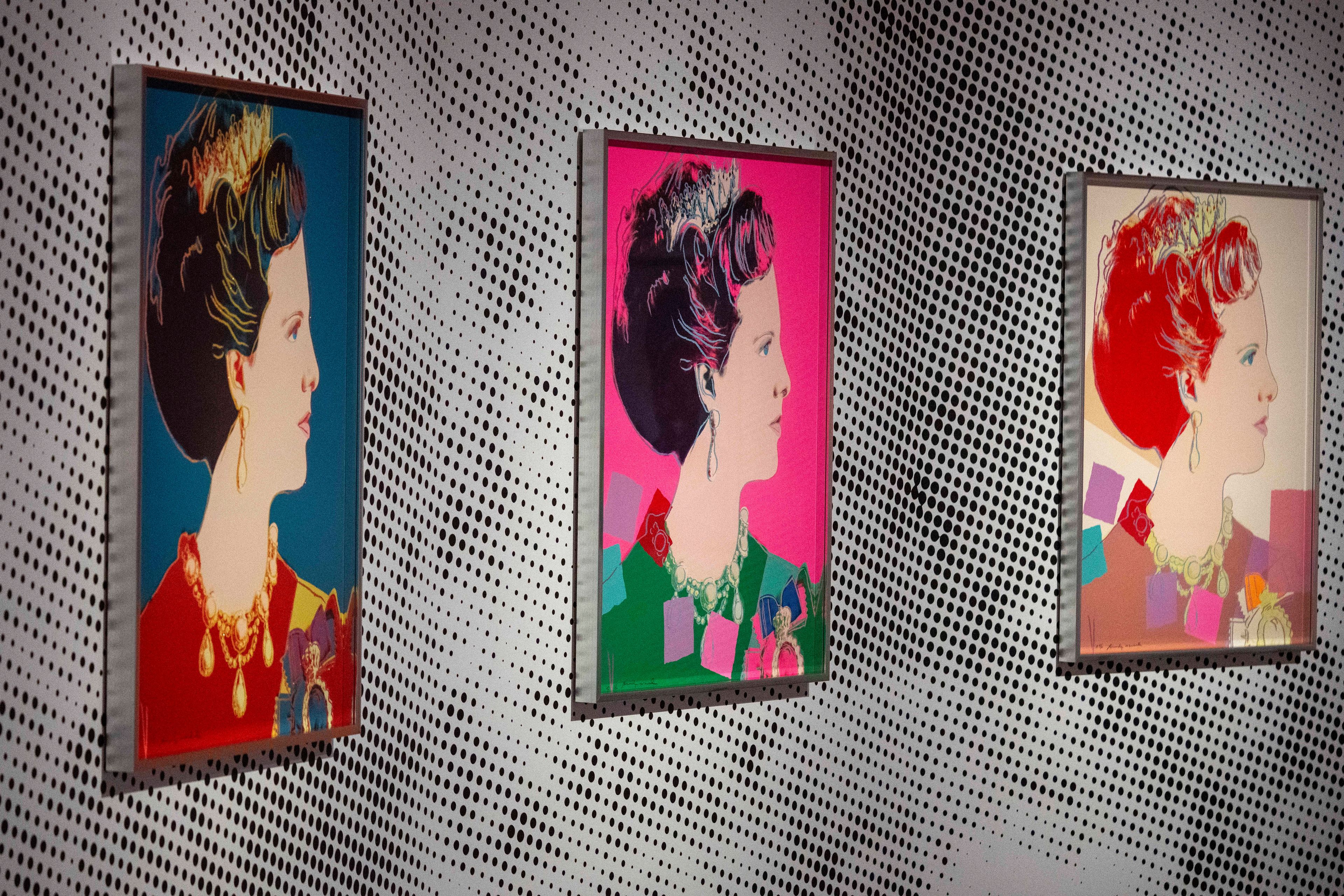 Screen prints depicting Queen Margrethe II of Denmark, part of a series of sixteen prints of four queens titled Reigning Queens, 1985, by Andy Warhol at museum Paleis Het Loo in Apeldoorn, Netherlands, Wednesday, Oct. 9, 2024, similar to a Warhol work stolen from a gallery in Oisterwijk, Netherlands, early Friday, Nov. 1, 2024. (AP Photo/Peter Dejong)