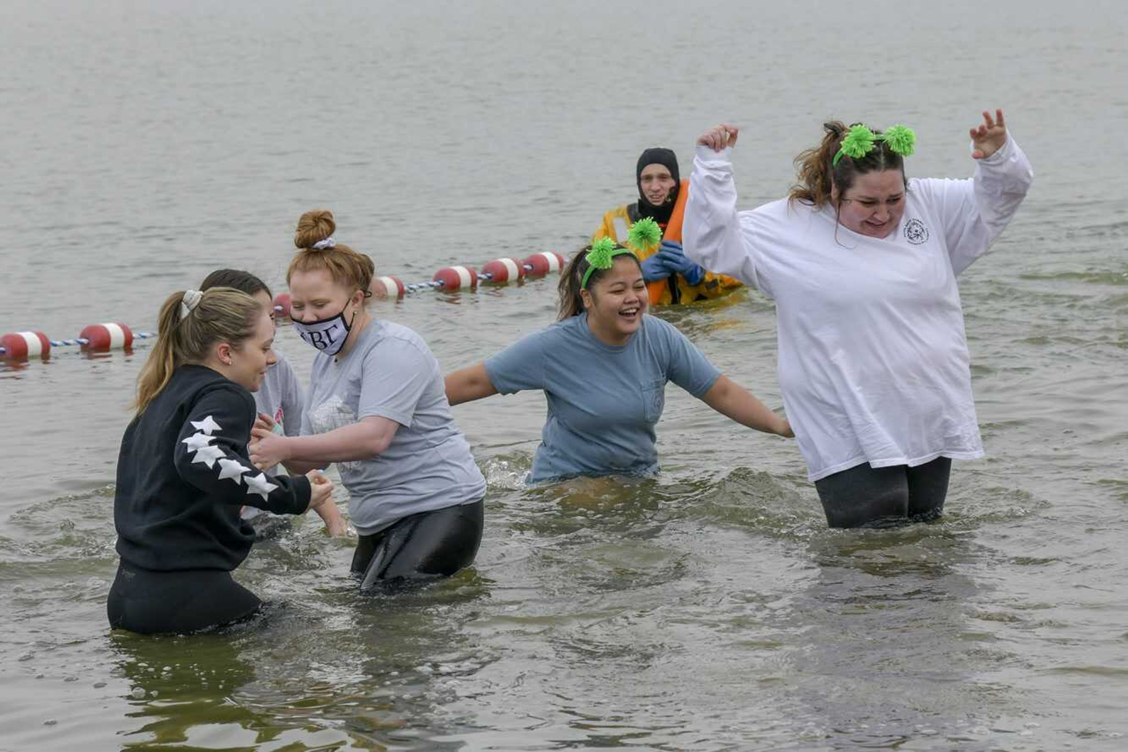 A group of Kappa Beta Gamma members from Southeast Missouri State University plunge in 39-degree water during the 15th annual Polar Plunge on Saturday at Cape County Park North in Cape Girardeau. The event raises money for Special Olympics Missouri. Read about it and see more photos in the next Weekend Good Times section.