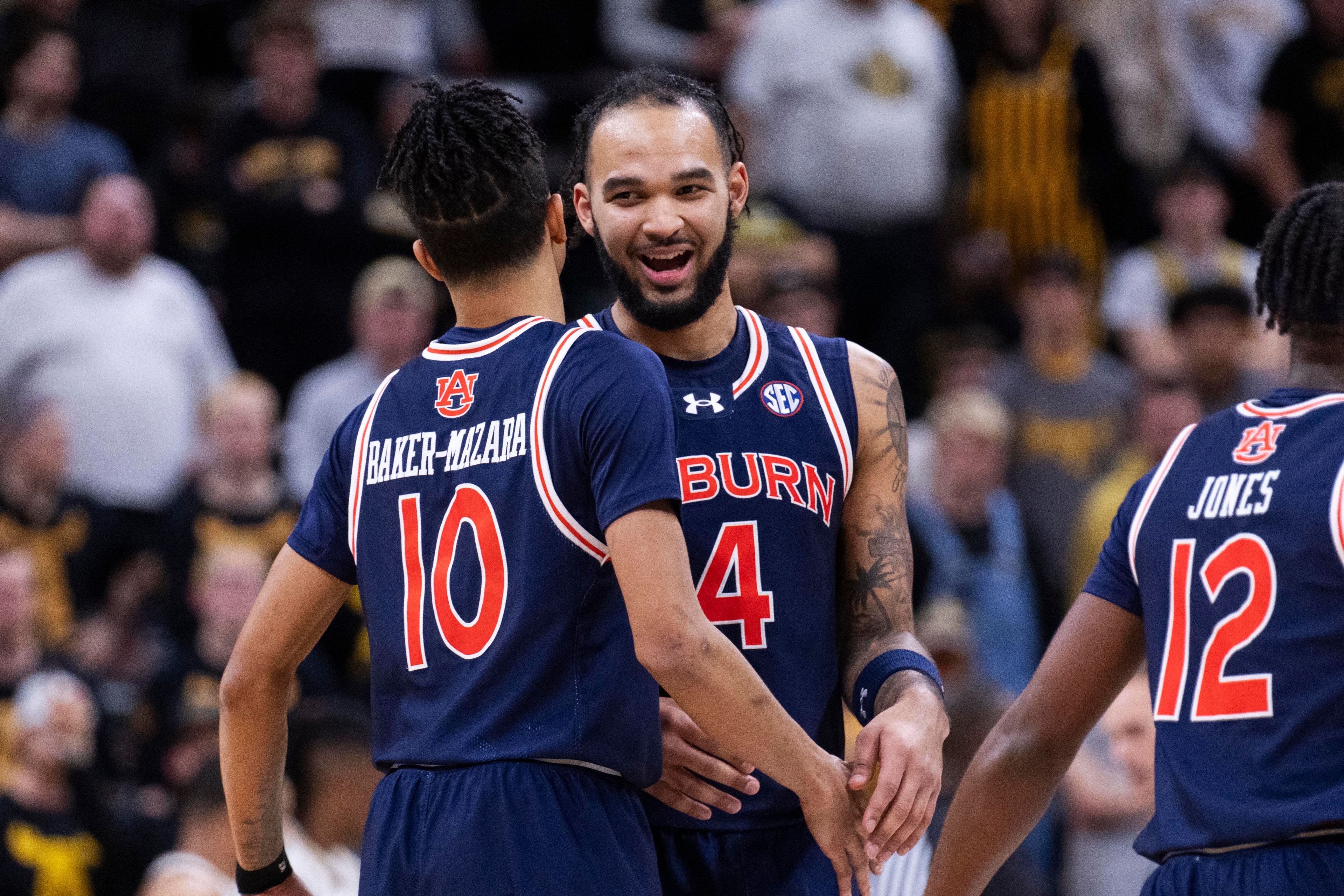 Auburn's Johni Broome, right, laughs with Chad Baker-Mazara, left, during the second half of the team's NCAA college basketball game against Missouri on Tuesday, March 5, 2024, in Columbia, Mo. (AP Photo/L.G. Patterson)