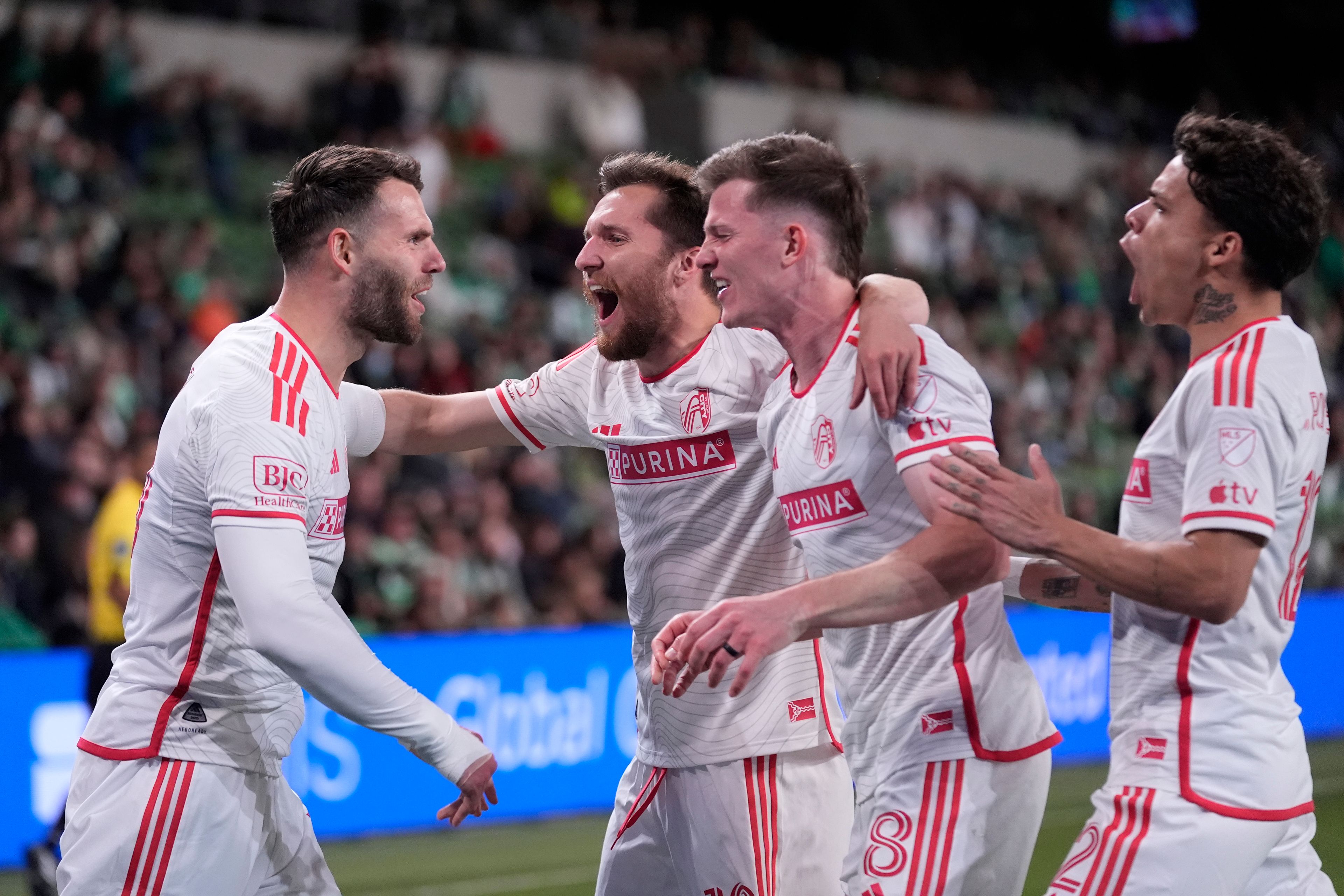 St. Louis City midfielder Eduard Lowen, left, celebrates with teammates after he scored against Austin FC during the second half of an MLS soccer match in Austin, Texas, Saturday, March 9, 2024. (AP Photo/Eric Gay)