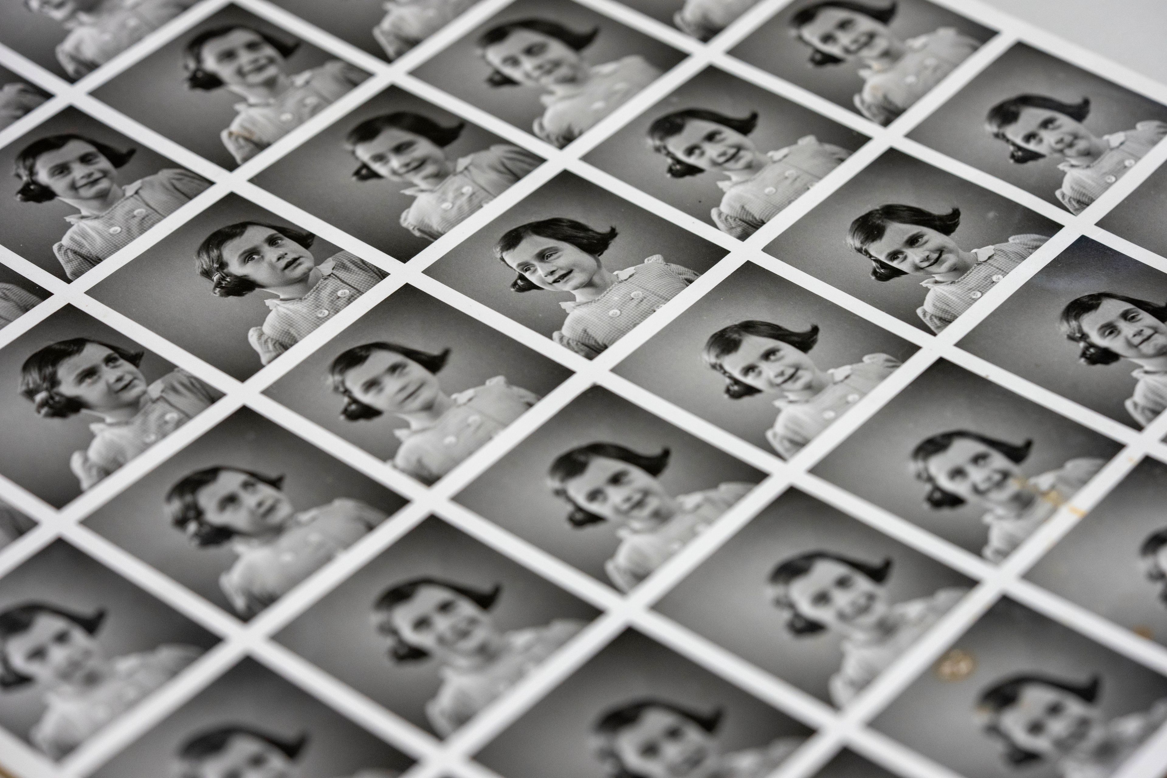 A sheet of pictures of Anne Frank is displayed in Amsterdam, Netherlands, Friday, Oct. 4, 2024, ahead of an exhibit in New York. (AP Photo/Peter Dejong)