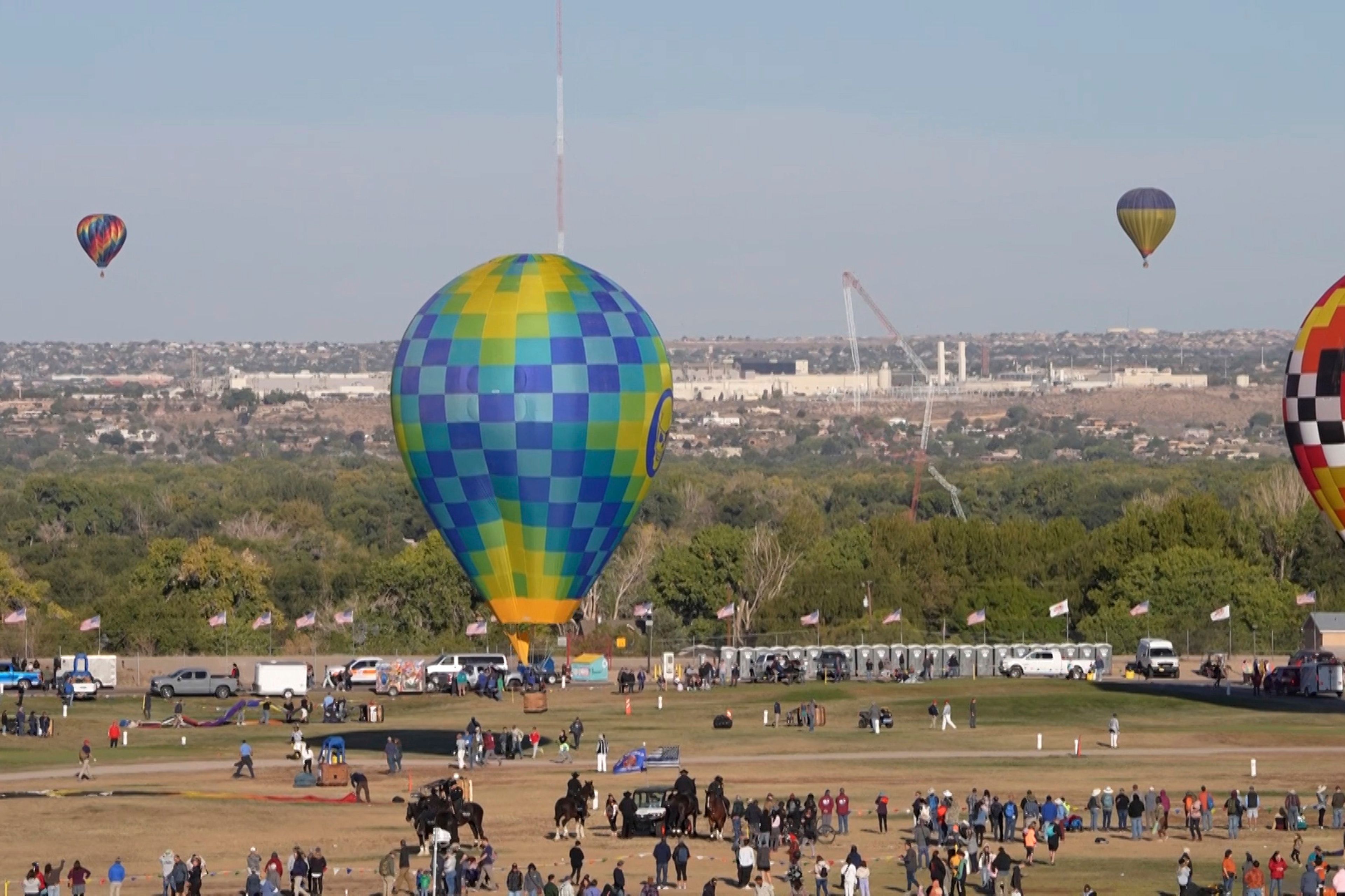 This image made from a video provided by Curt Fargo shows a radio tower collapsing after a hot-air balloon struck it during the famous festival in Albuquerque, N.M., Oct. 11, 2024. (Curt Fargo via AP)