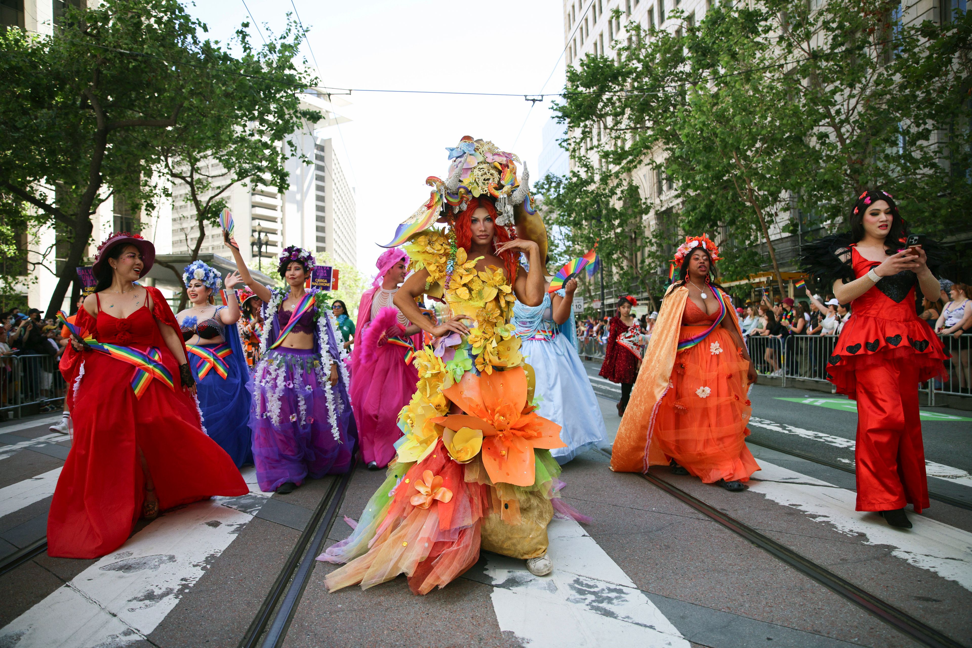 Revelers wear colorful costumes during a Pride Parade, Sunday, June 30, 2024, in San Francisco. (AP Photo/Ethan Swope)