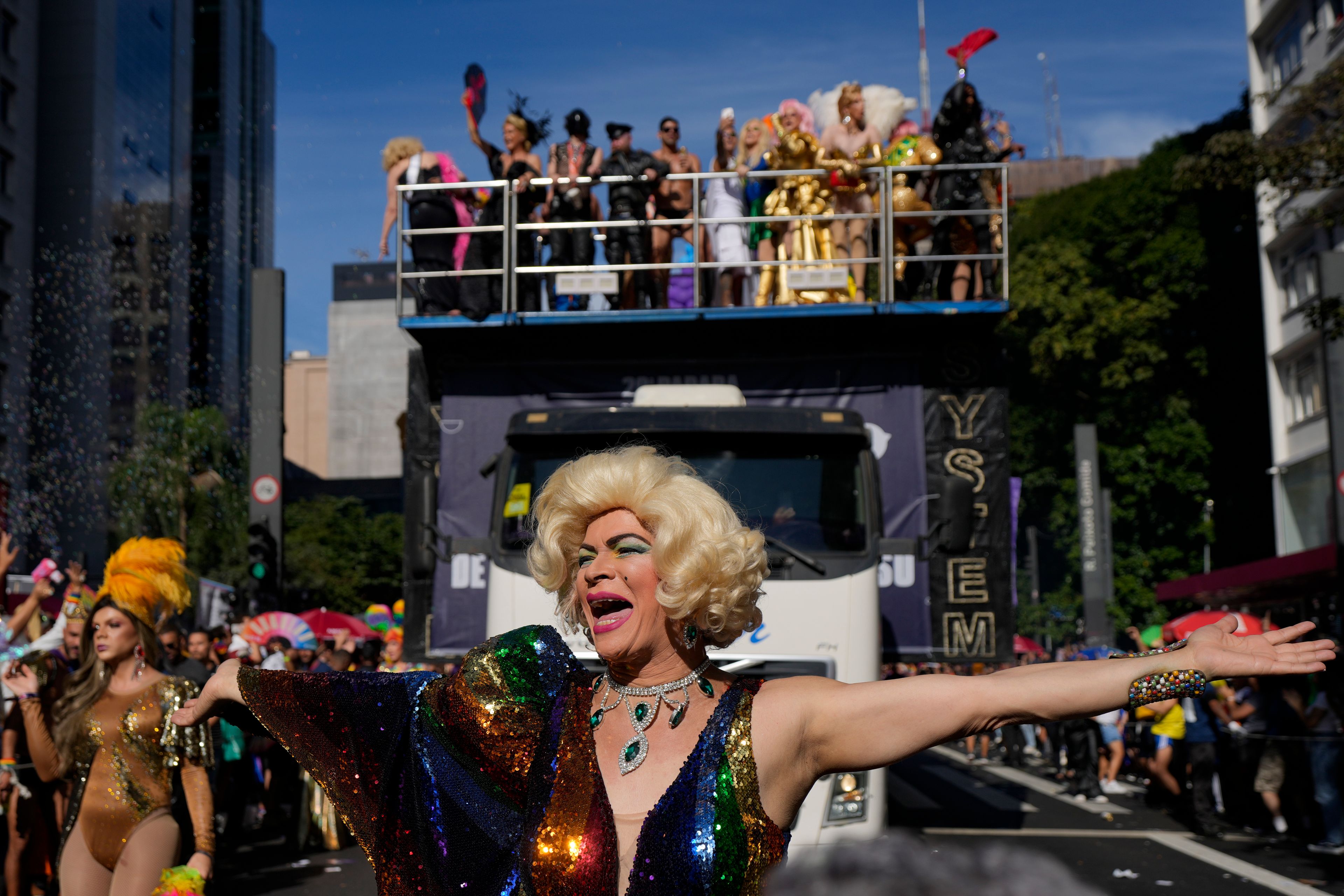 A reveler dances during the annual Gay Pride Parade in Sao Paulo, Sunday, June 2, 2024. (AP Photo/Andre Penner)