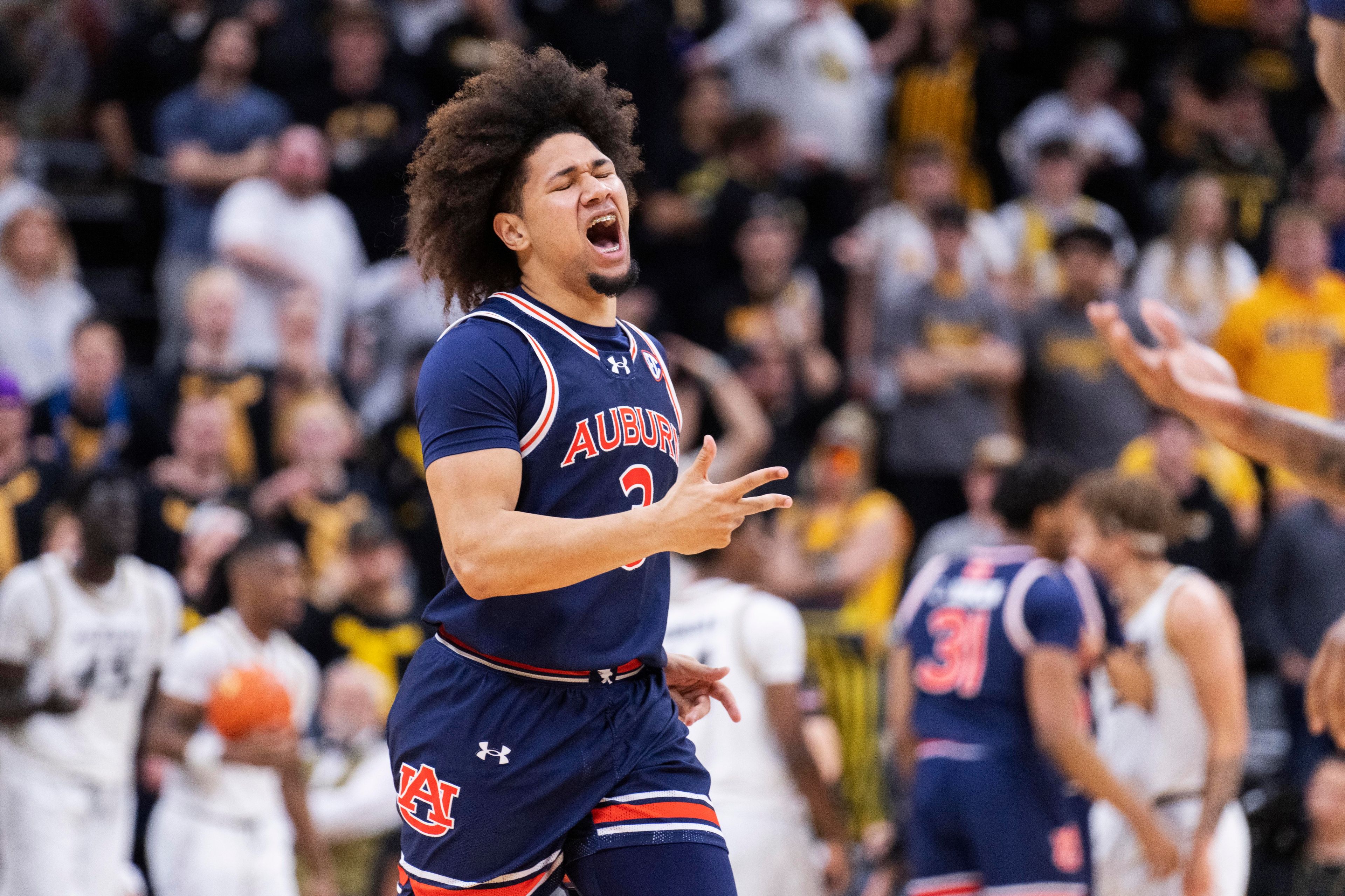 Auburn's Tre Donaldson celebrates a 3-point basket against Missouri during the second half of an NCAA college basketball game Tuesday, March 5, 2024, in Columbia, Mo. (AP Photo/L.G. Patterson)