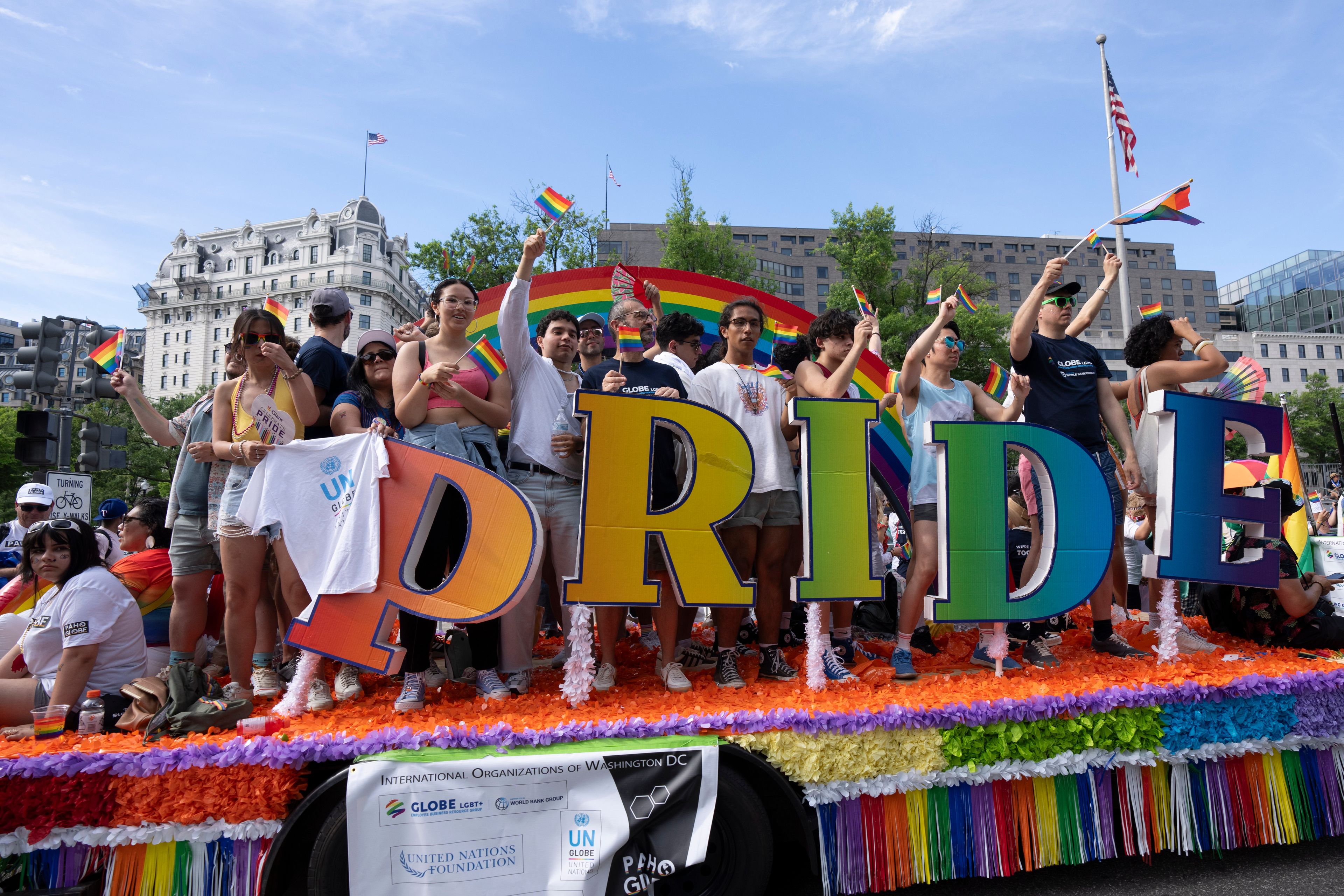 Participants of the Capital Pride Parade wave from a float during the annual celebrations of the LGBTQ+ community and supporters in Washington, Saturday, June 8, 2024. (AP Photo/Manuel Balce Ceneta)