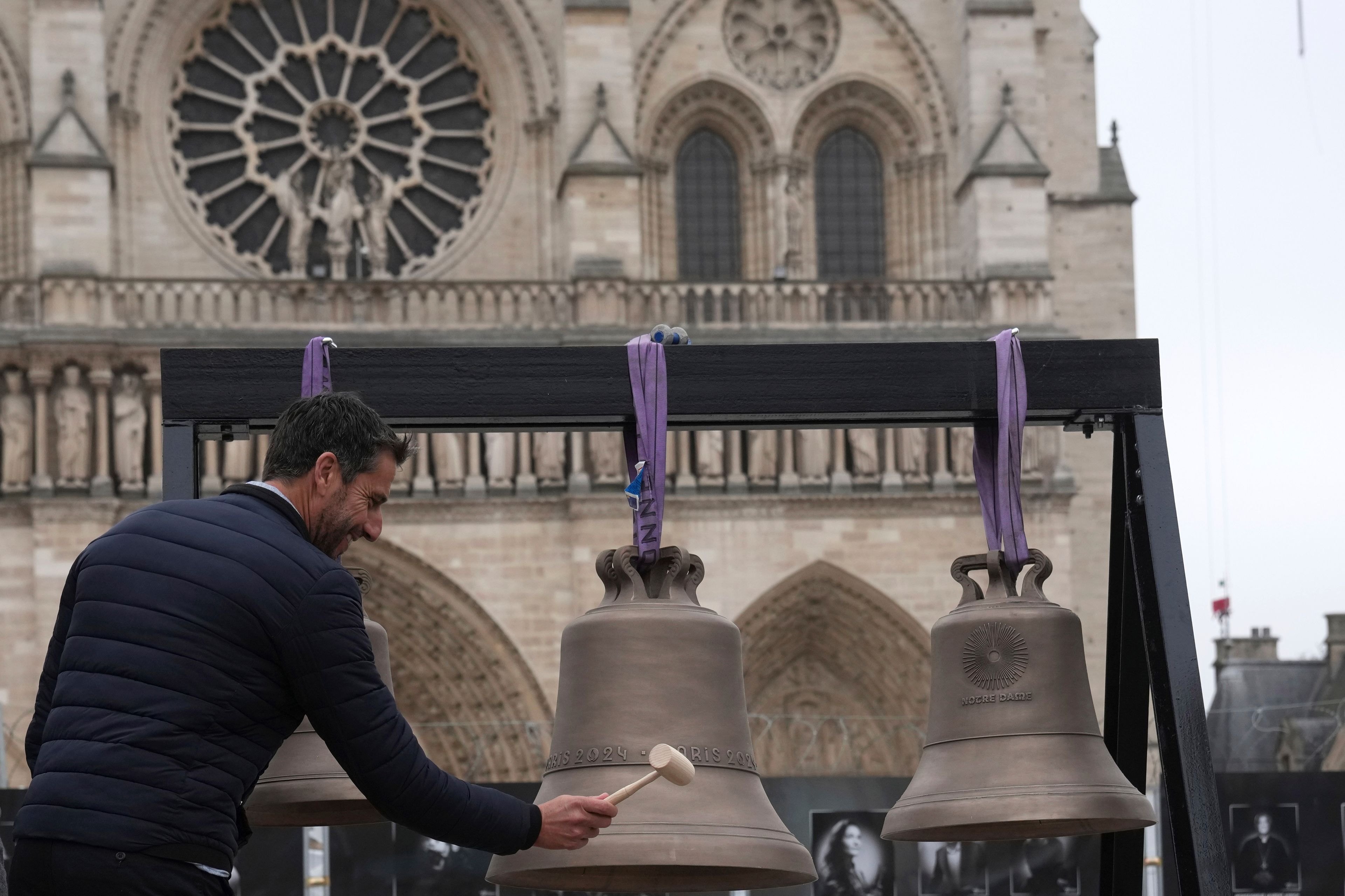 Tony Estanguet, head of Paris 2024 Olympic Games, rings the bell that Olympic medalists rang at the Paris Games, before its installation in Notre-Dame cathedral, ahead of the monument's grandiose reopening following a massive fire and five-year reconstruction effort, Thursday, Nov. 7, 2024 in Paris. (AP Photo/Christophe Ena)