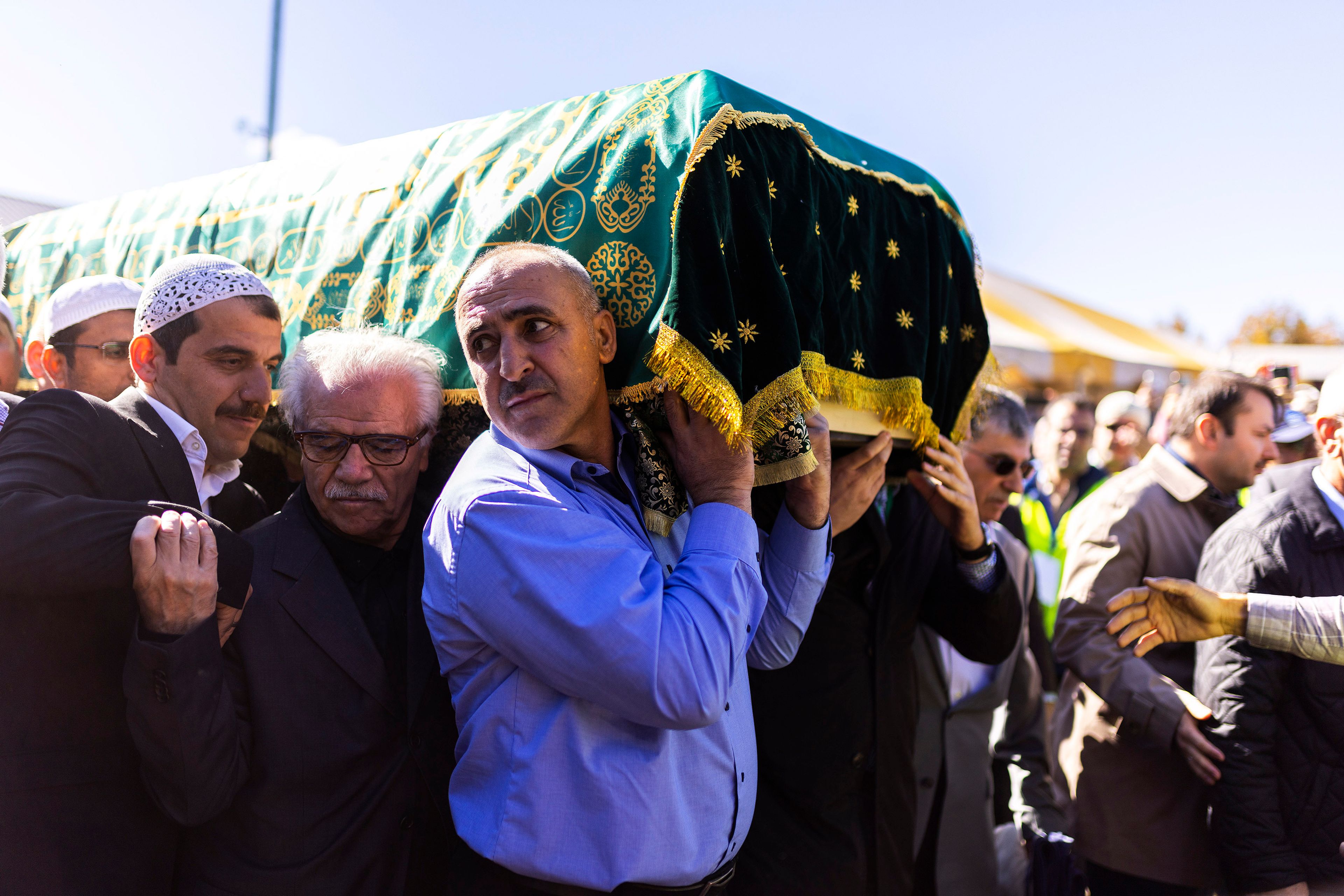 Mourners carry the casket of Fethullah Gülen, an influential Turkish spiritual leader and Islamic scholar who died this week in self-exile in the United States, at a funeral prayer service, Thursday, Oct, 24, 2024, in Augusta, N.J. (AP Photo/Eduardo Munoz Alvarez)