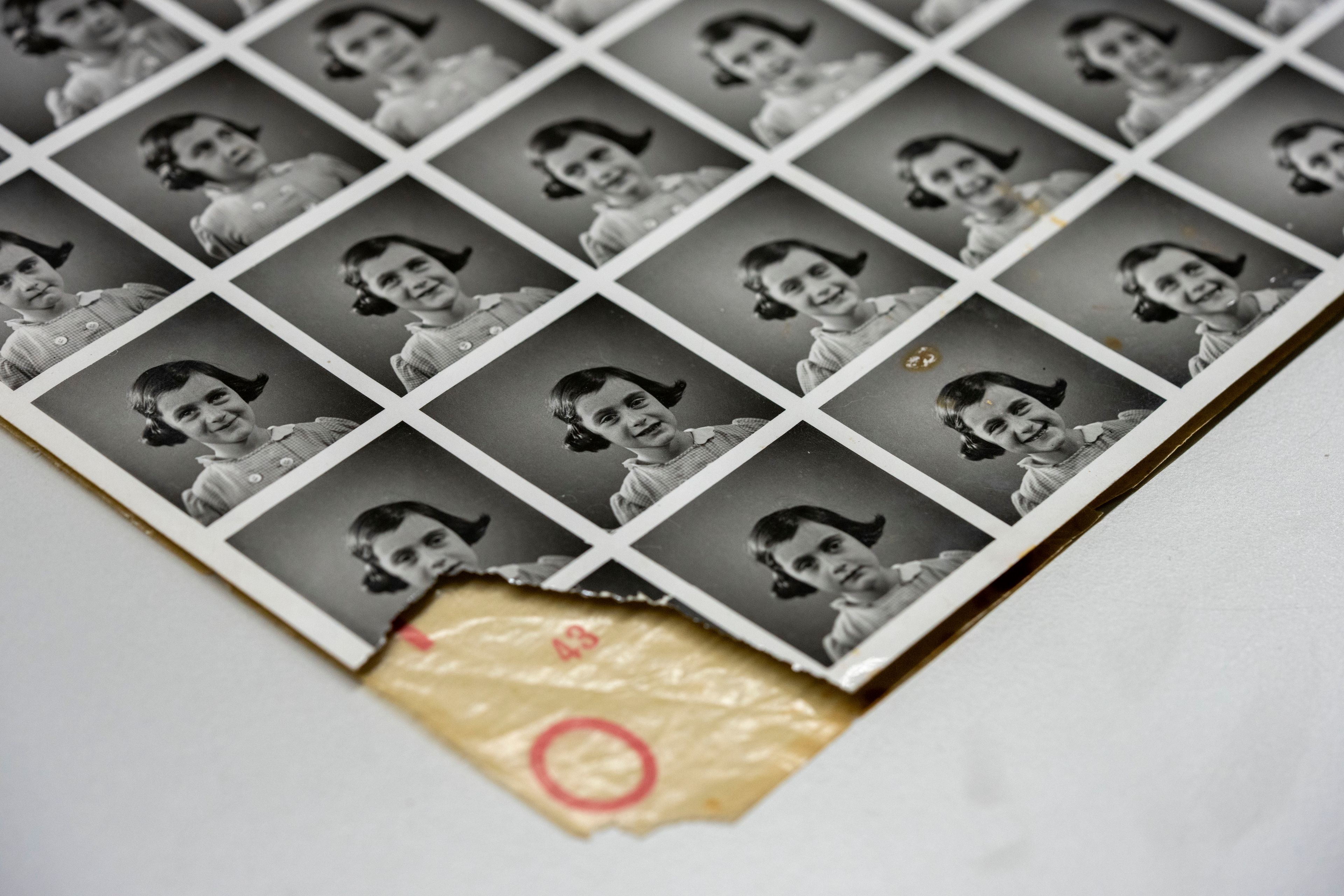 A sheet of pictures of Anne Frank is displayed in Amsterdam, Netherlands, Friday, Oct. 4, 2024, ahead of an exhibit in New York. (AP Photo/Peter Dejong)