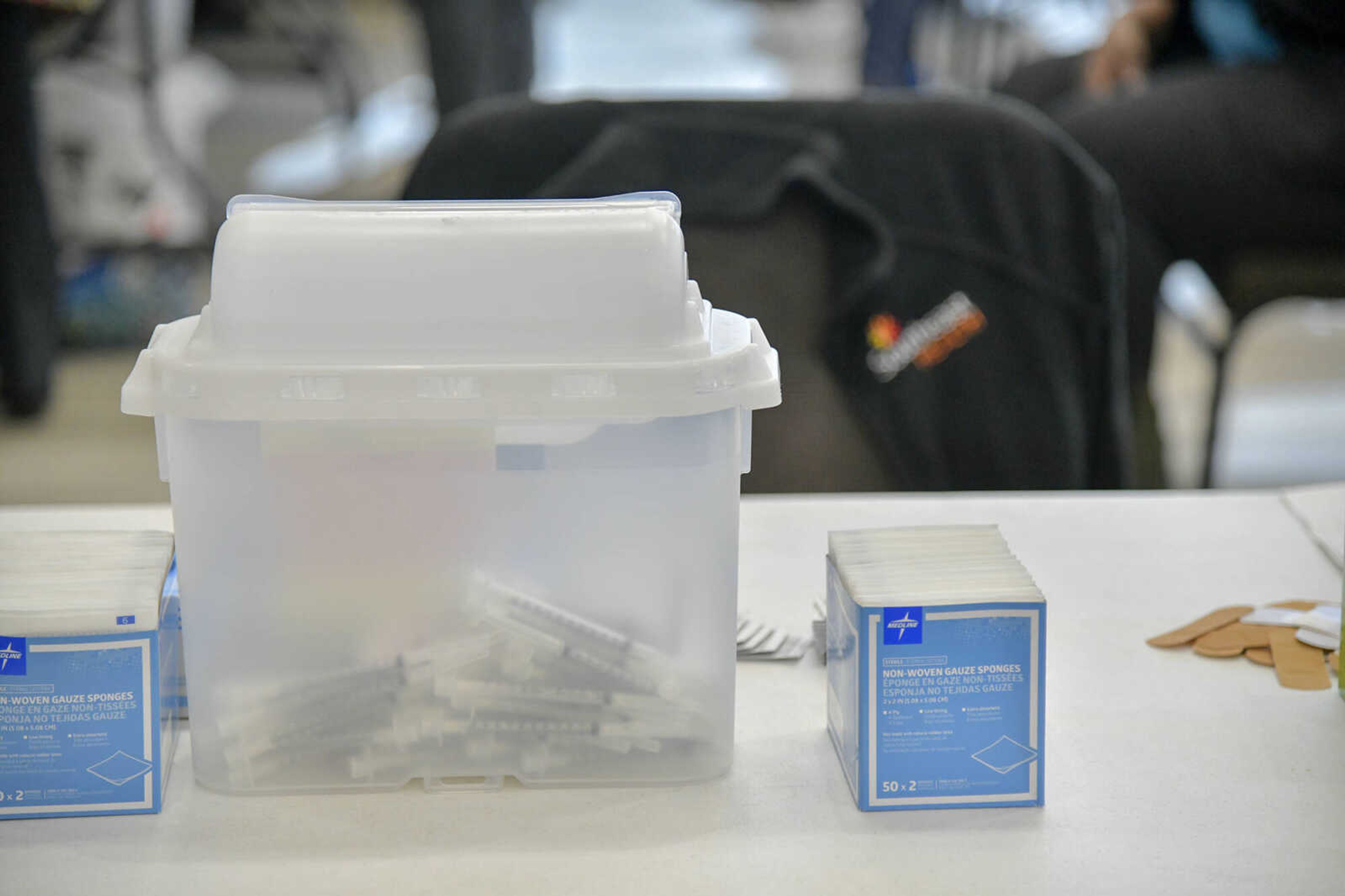 Needles that were recently used for distributing the COVID-19 vaccine are seen in a semi-clear medical waste bin during a SoutheastHEALTH vaccination clinic at Jackson Civic Center on Wednesday, Jan. 20, 2021.