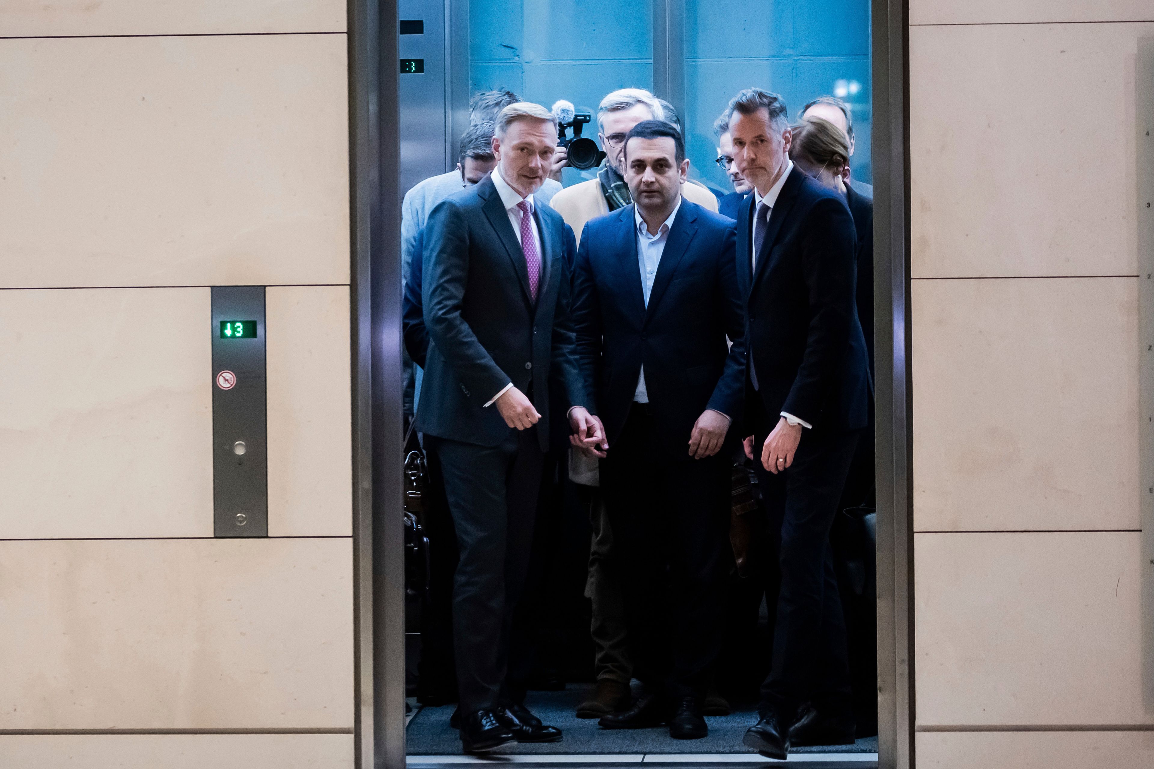 Federal Minister of Finance Christian Lindner, from left, joins Bijan Djir-Sarai, Free Democratic Party Secretary General, and Christian Dürr, Chairman of the Free Democratic Party parliamentary group, for a press statement after his dismissal by the Federal Chancellor Olaf Scholz, in Berlin, Wednesday, Nov. 6, 2024. (Christoph Soeder/dpa via AP)