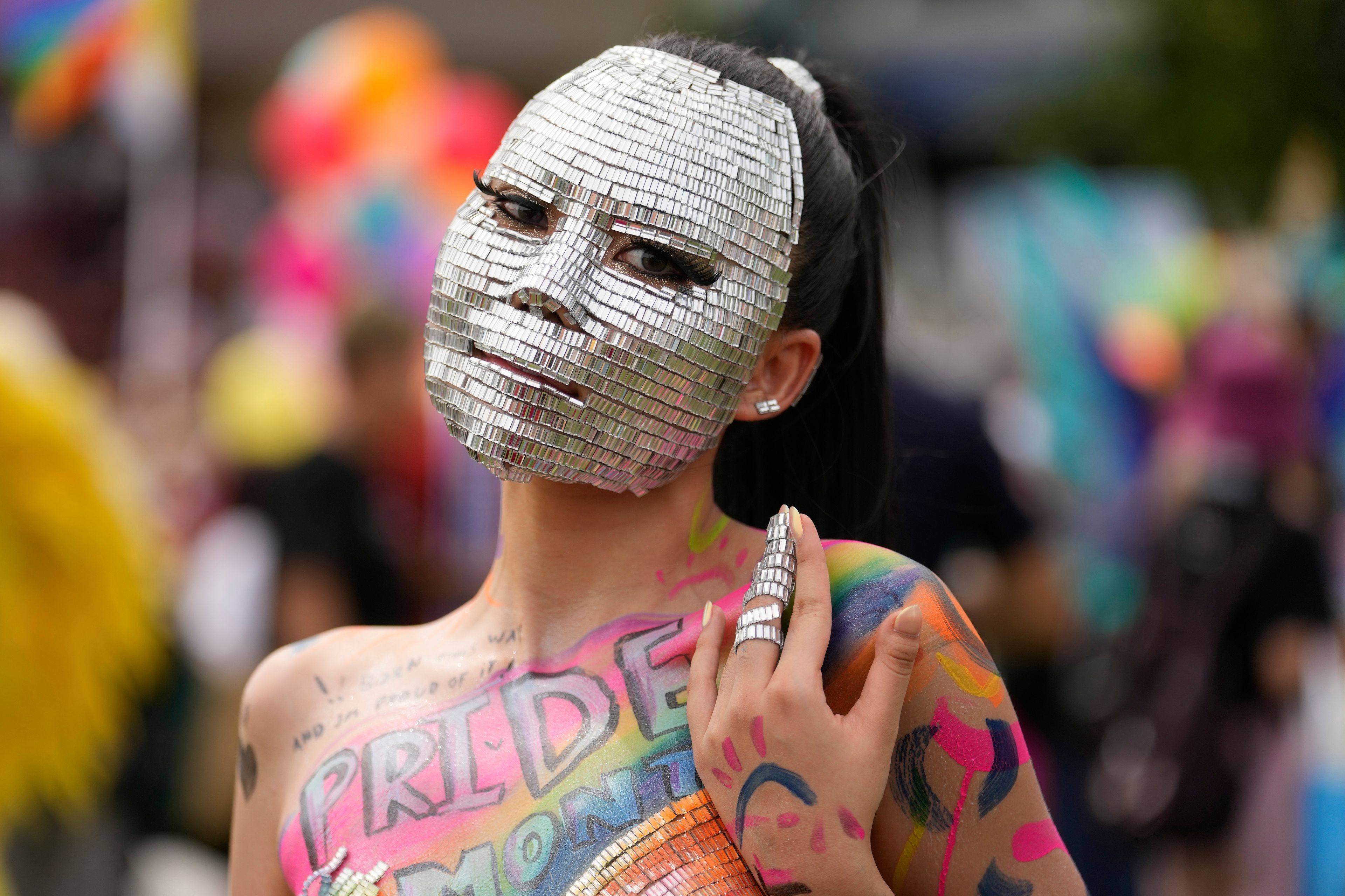 A participant with body paint takes part in the Pride Parade in Bangkok, Thailand, Saturday, June 1, 2024. (AP Photo/Sakchai Lalit)