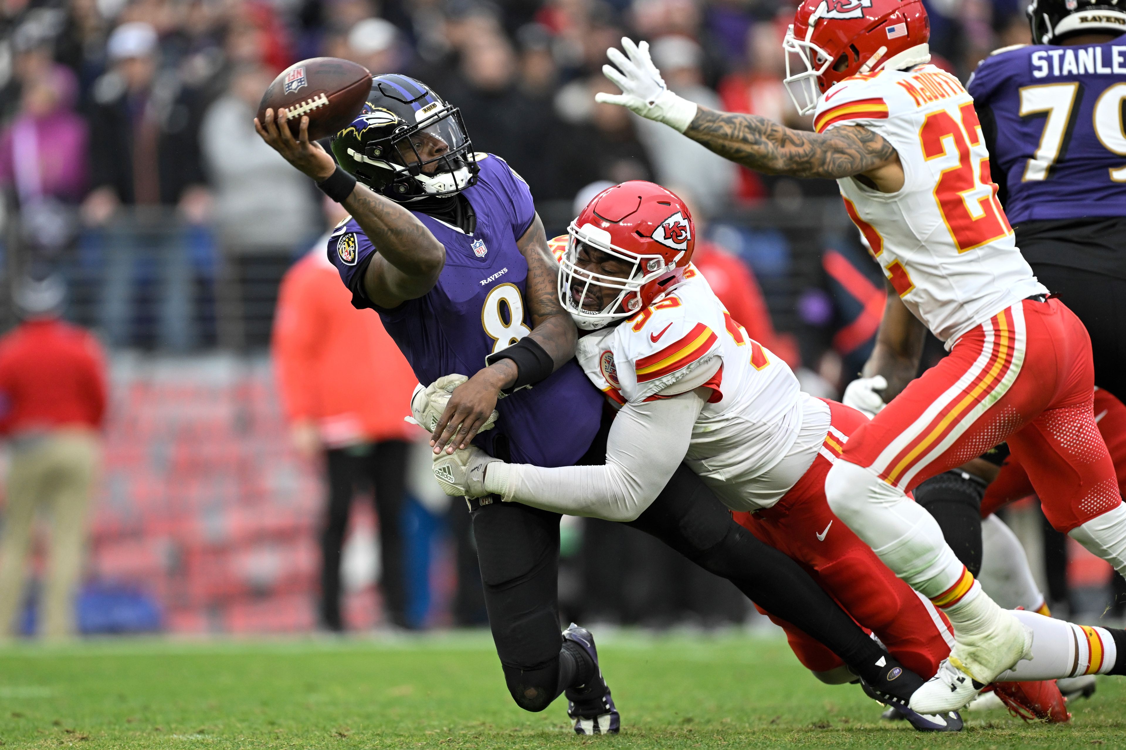 FILE - Baltimore Ravens quarterback Lamar Jackson (8) is pressured by Kansas City Chiefs defensive tackle Chris Jones during the first half of the AFC Championship NFL football game in Baltimore, Sunday, Jan. 28, 2024. Kirk Cousins, Chris Jones and Mike Evans are among the best players who will be available on the open market unless their teams use a franchise tag by March 5. They’ll be joined by running backs Derrick Henry, Saquon Barkley and Josh Jacobs, edge rushers Josh Allen, Brian Burns and Danielle Hunter and several other talented players.(AP Photo/Terrance Williams, File)