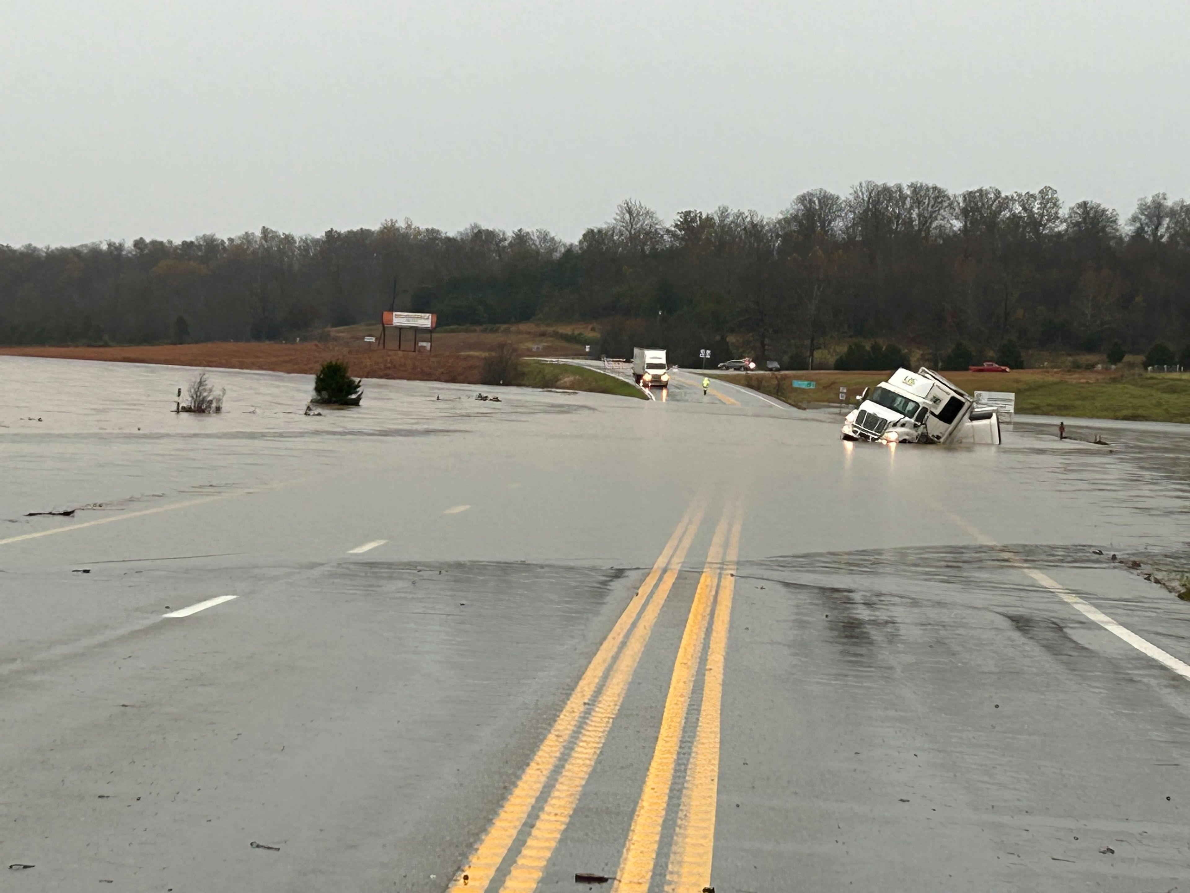 In a photo released by the Missouri State Highway Patrol, tractor trailer sits submerged in flood water on US 63 just north of Cabool, Mo., Tuesday, Nov. 5, 2024. (Missouri State Highway Patrol via AP)