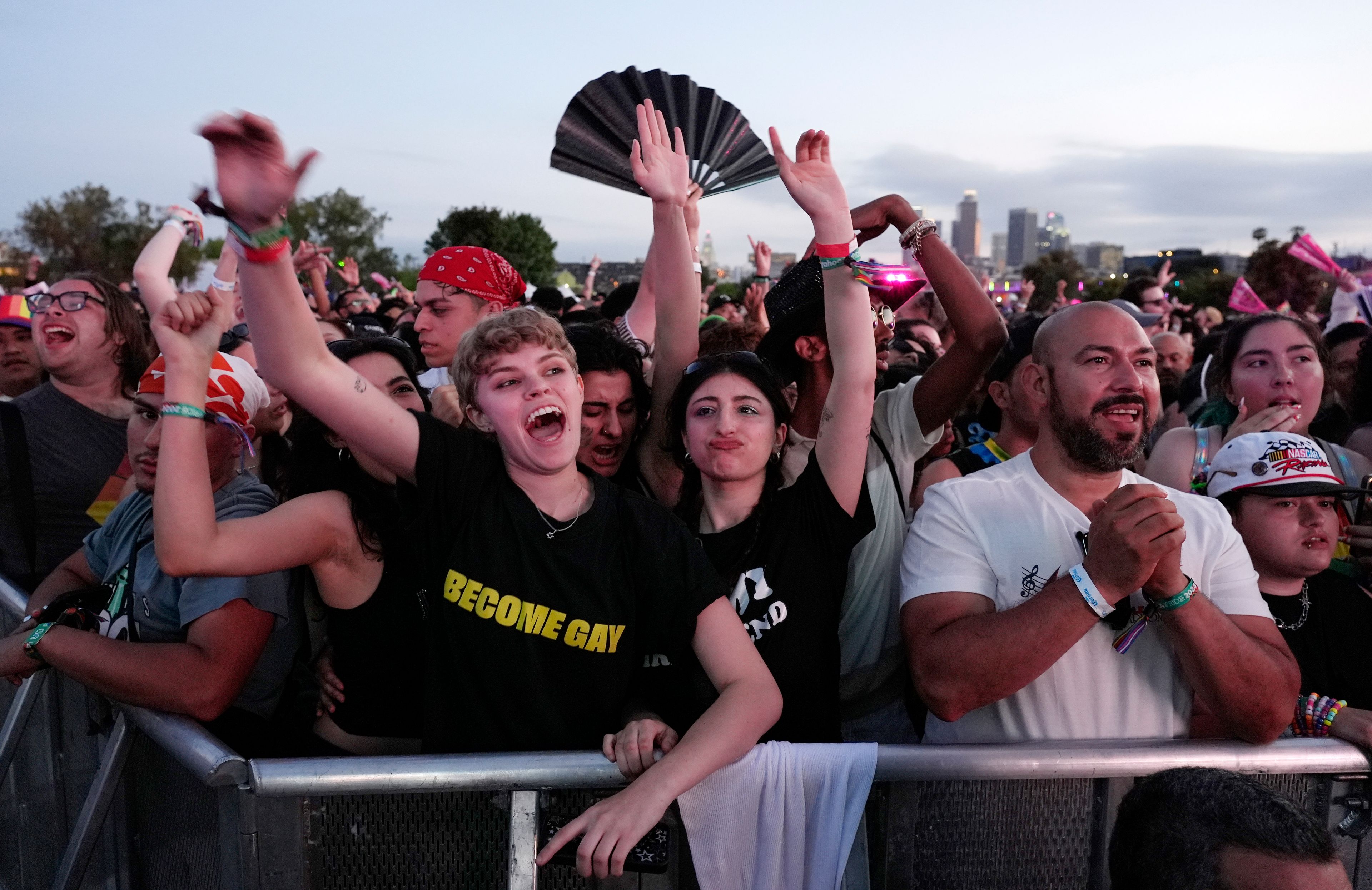 Festivalgoers react to music during the LA Pride in the Park concert at Los Angeles State Historic Park, Saturday, June 8, 2024, in Los Angeles. (AP Photo/Chris Pizzello)