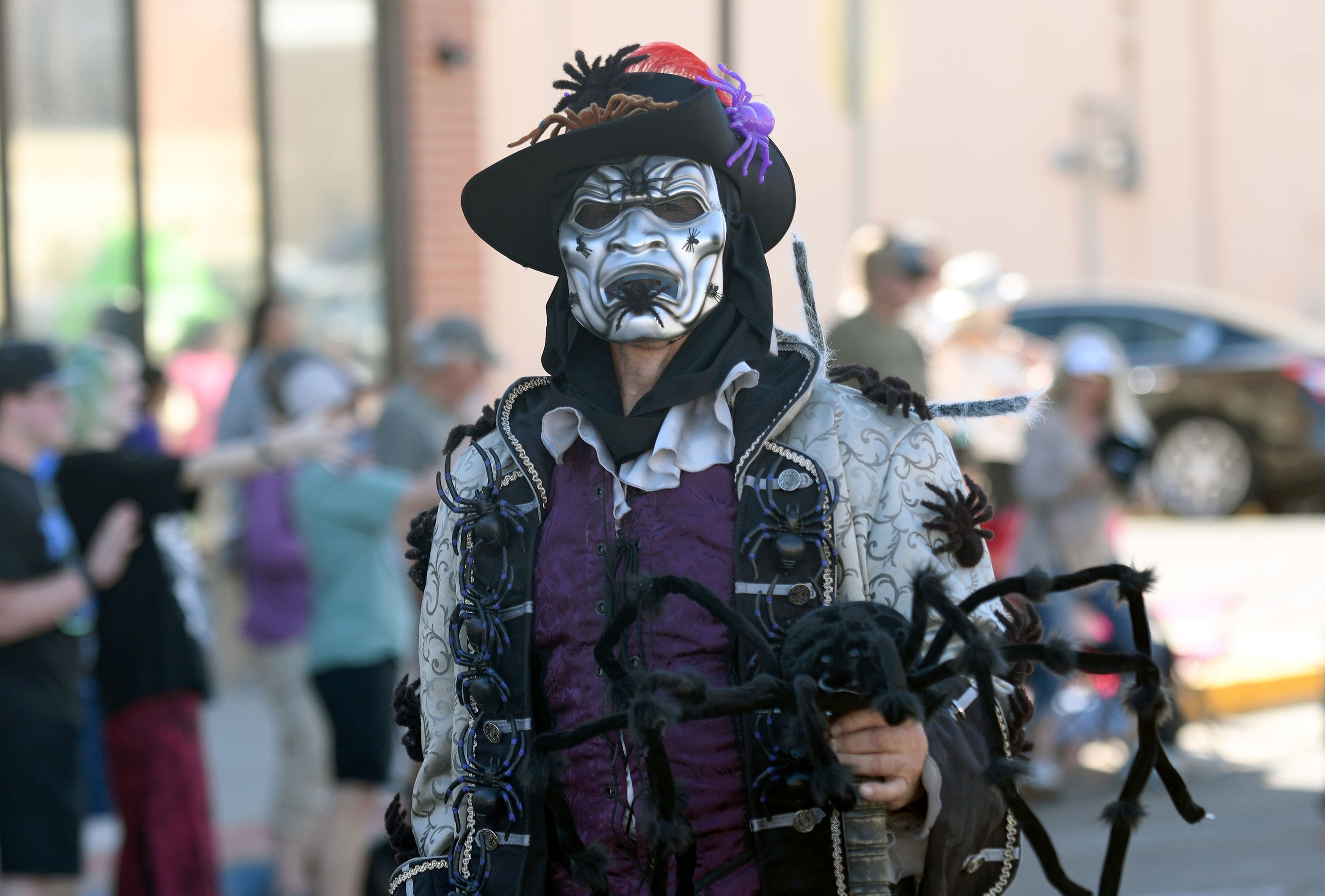 A man walks in the Tarantula Festival parade in La Junta, Colo., Saturday, Sept. 28, 2024. (AP Photo/Thomas Peipert)