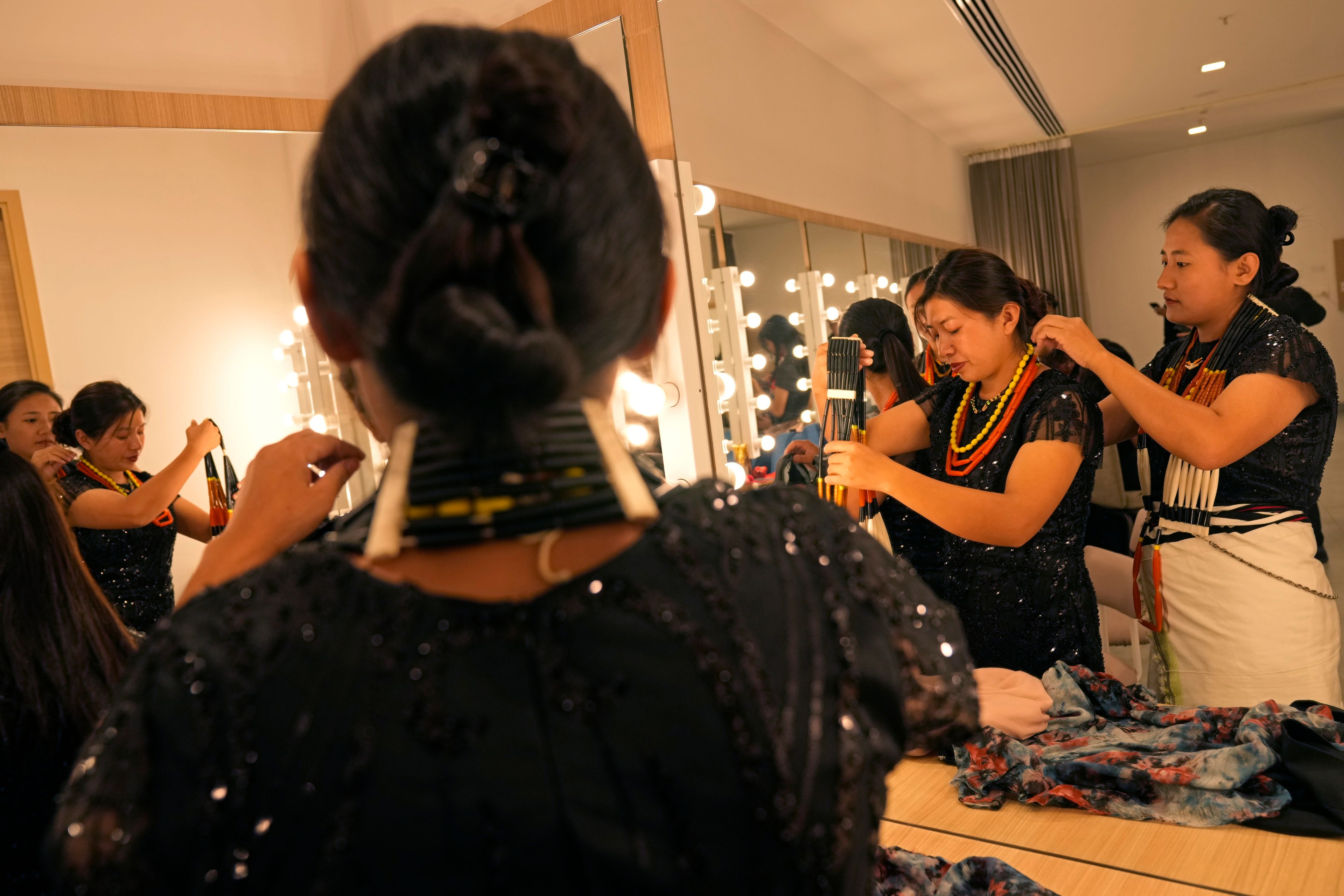 Artists from India's northeastern state of Nagaland prepare before a performance at the two-day Brillante Piano Festival in Bengaluru, India, Sunday, Sept. 29, 2024. (AP Photo/Aijaz Rahi)