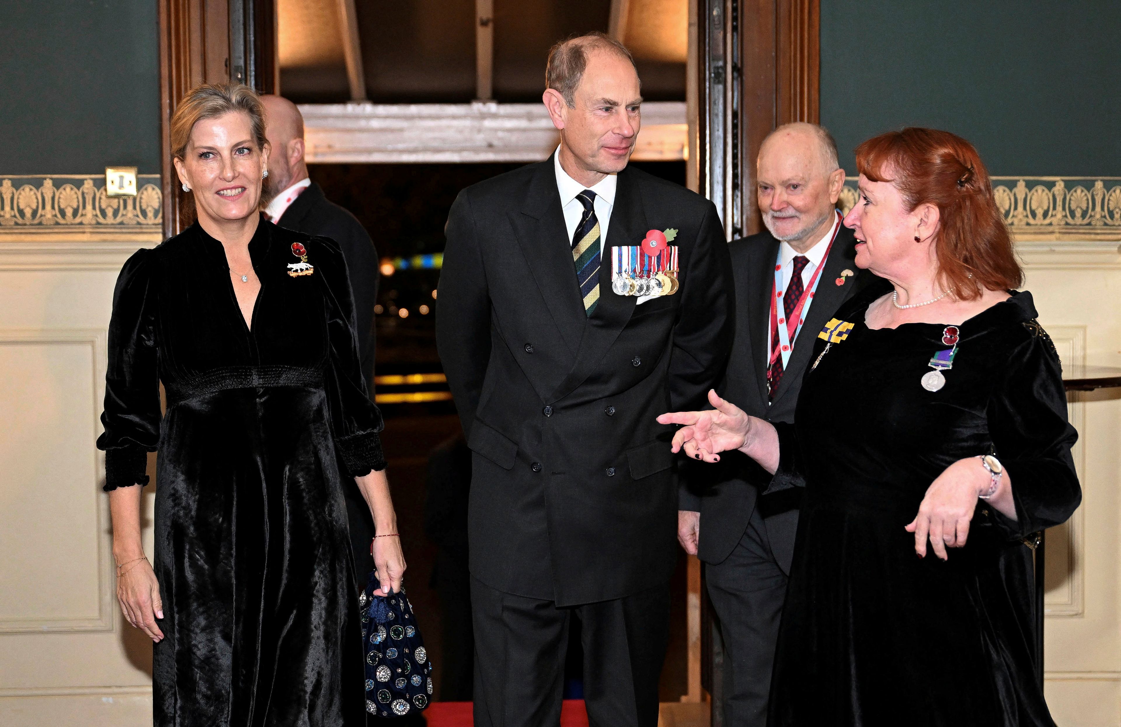 Prince Edward, Duke of Edinburgh, center, and Sophie, Duchess of Edinburgh, left, attend the Royal British Legion Festival of Remembrance at the Royal Albert Hall in London, Saturday Nov. 9, 2024. (Chris J. Ratcliffe/Pool Photo via AP)