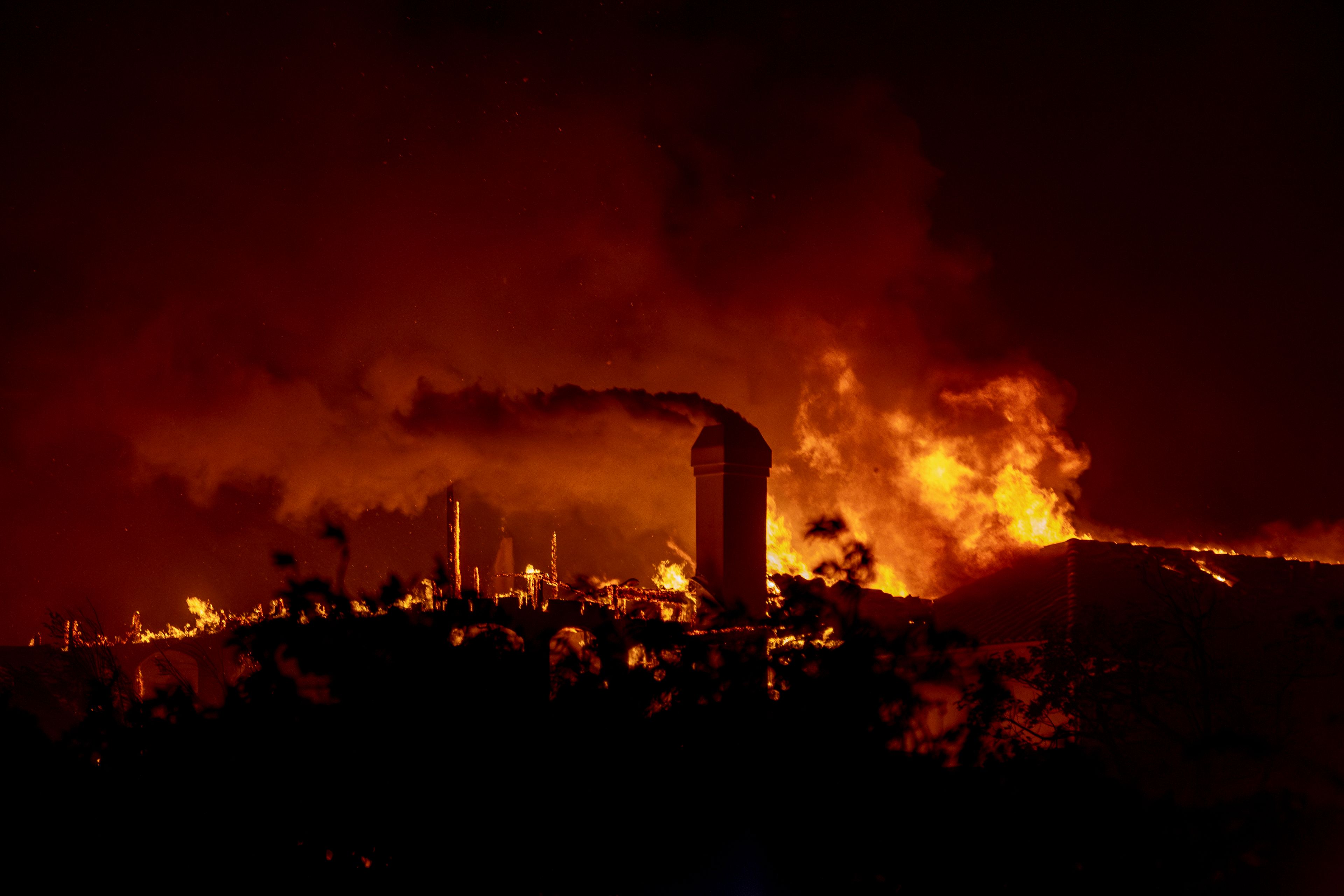 Flames engulf a structure during the Mountain Fire in Camarillo, Calif., Wednesday, Nov. 6, 2024. (Stephen Lam/San Francisco Chronicle via AP)