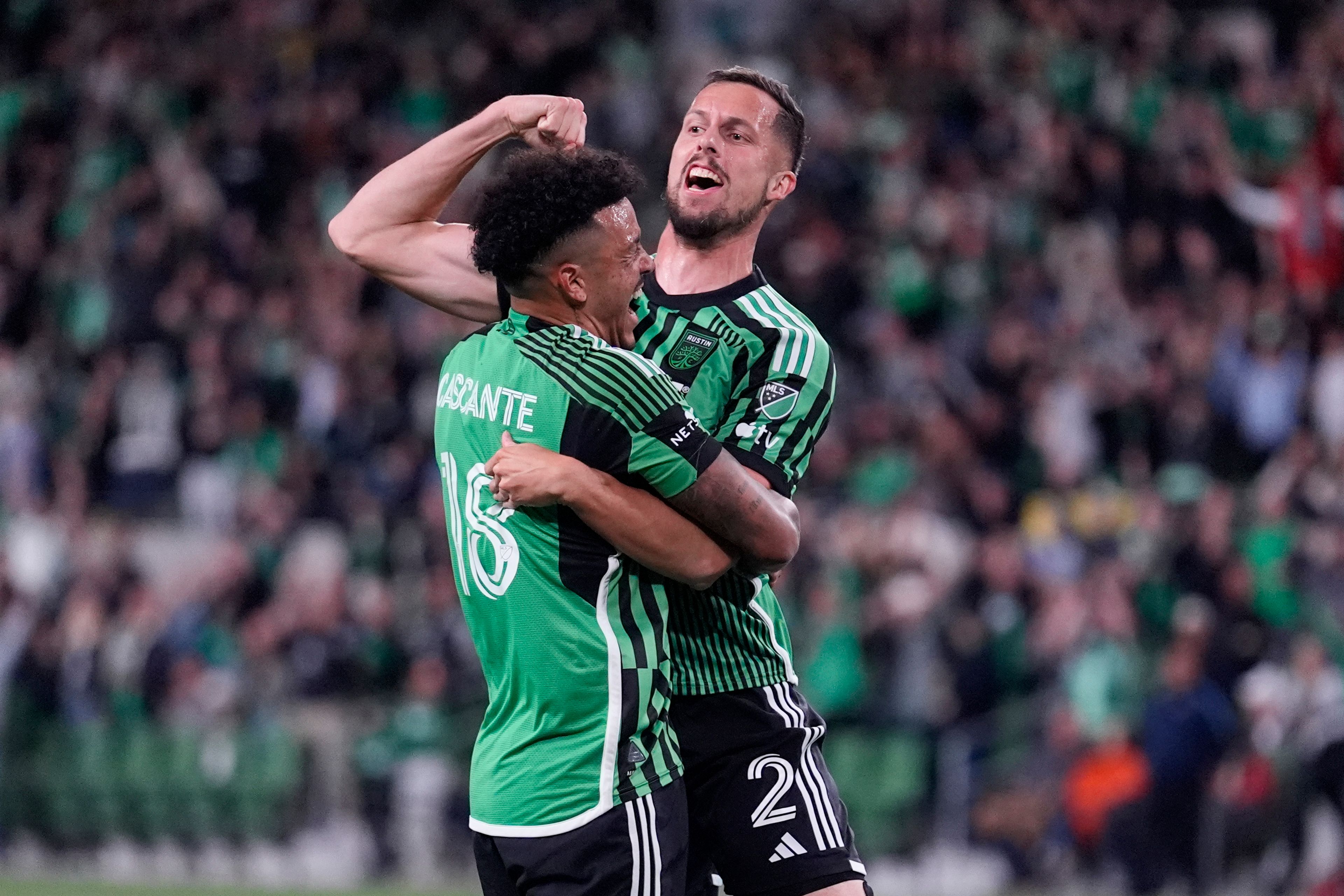 Austin FC defender Matt Hedges (2) celebrates with teammate Julio Cascante (18) after scoring against St. Louis City during the first half of an MLS soccer match in Austin, Texas, Saturday, March 9, 2024. (AP Photo/Eric Gay)