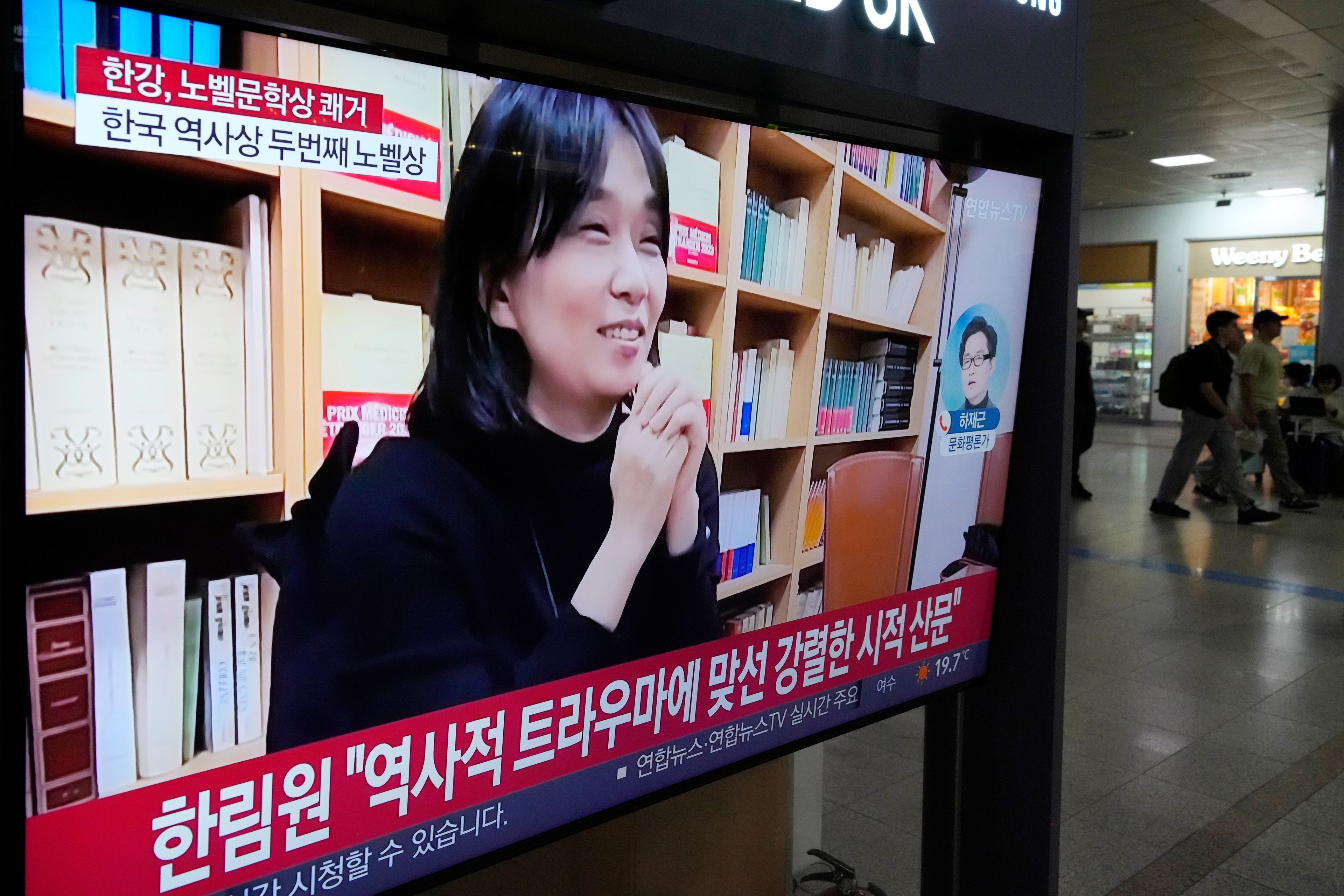 A TV screen shows an image of the winner of the 2024 Nobel Prize in Literature, South Korean writer Han Kang, during a news program at Seoul Railway Station in Seoul, South Korea, Thursday, Oct. 10, 2024. (AP Photo/Ahn Young-joon)