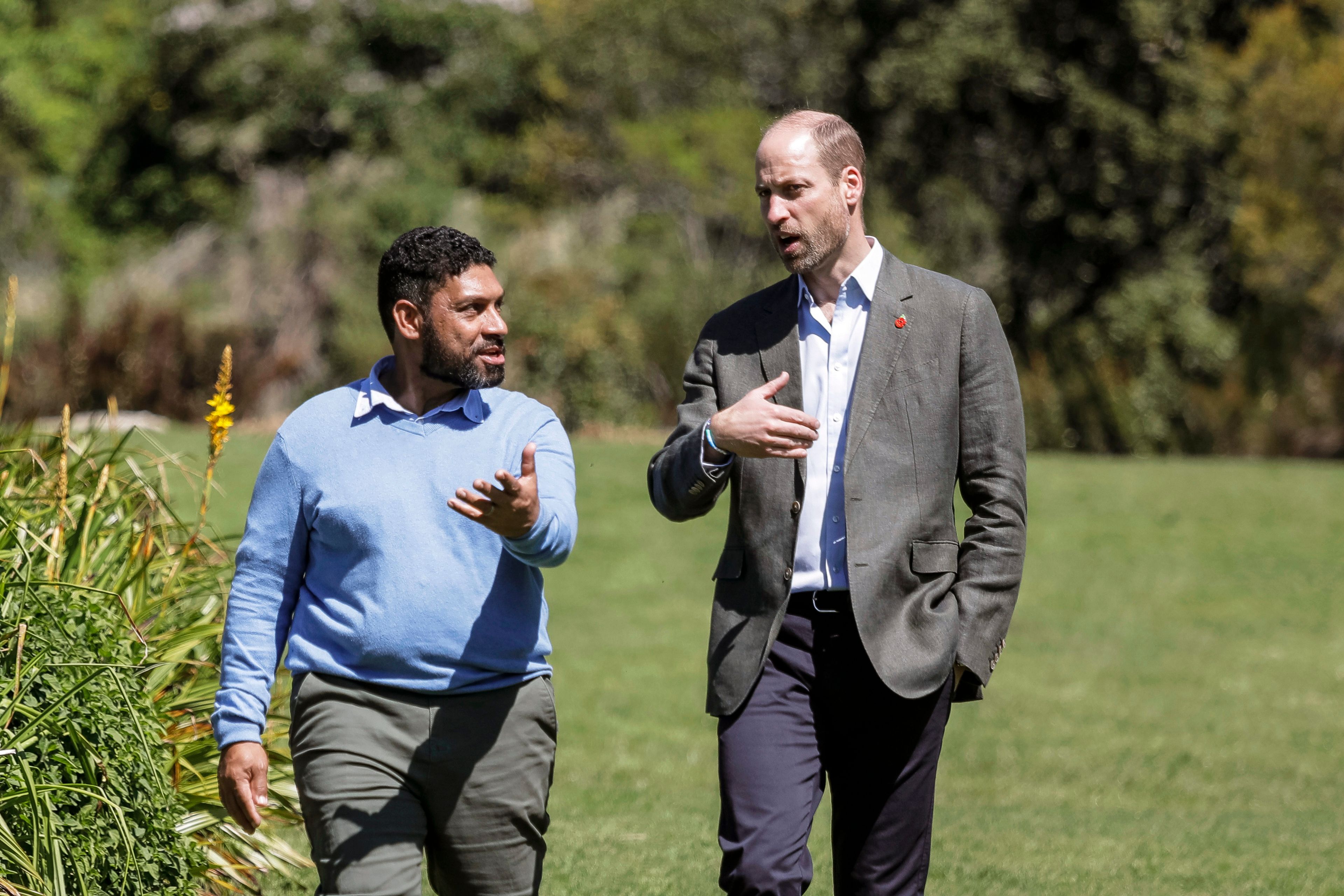 Britain's Prince William, Prince of Wales, right, walks with Garden Director Werner Voigt before a meeting with the 2024 Earthshot Prize Finalists, at Kirstenbosch National Botanical Garden in Cape Town, South Africa, Wednesday, Nov. 6, 2024. (Gianluigi Guercia, Pool Photo via AP)