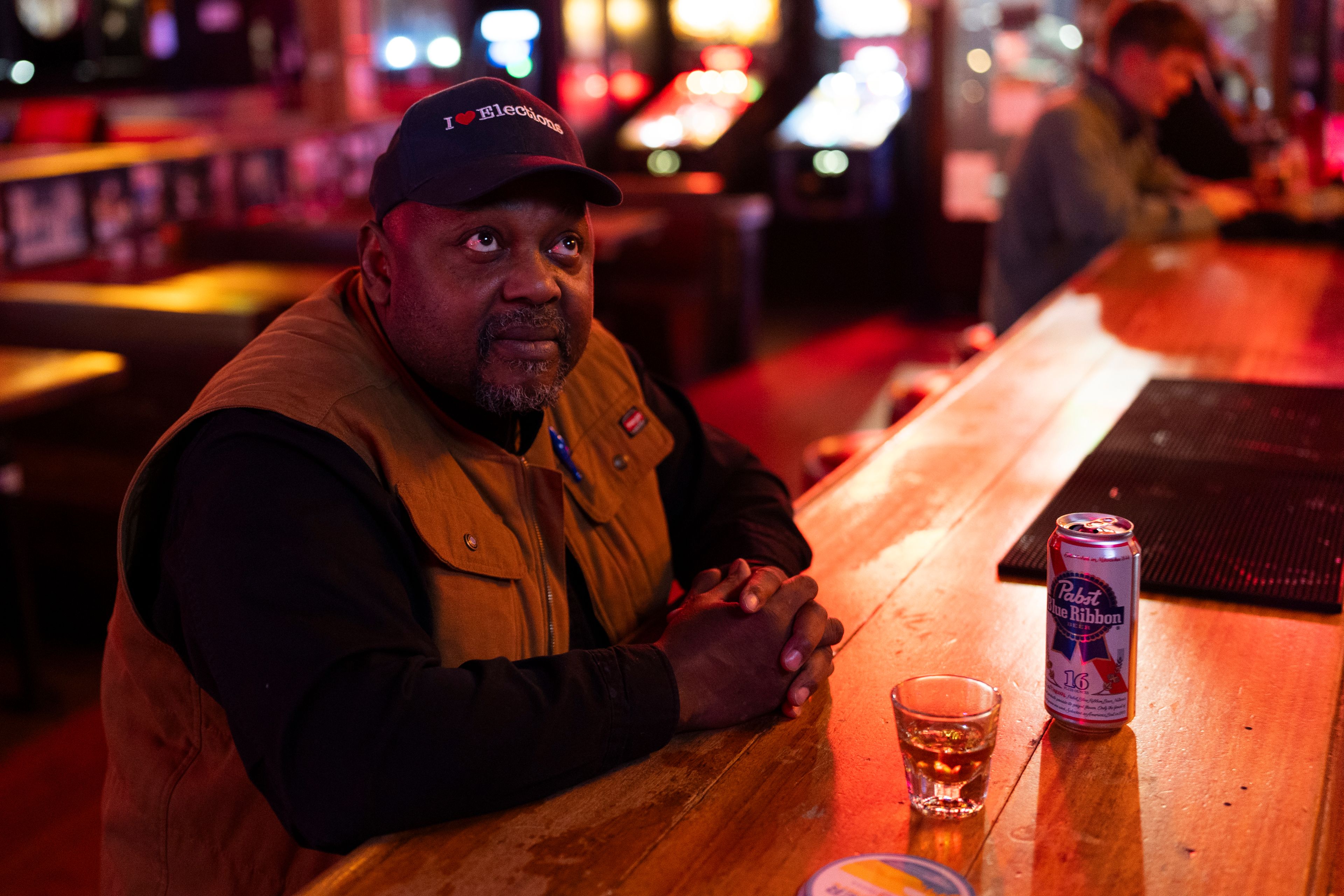 Lawson Beard, who said he voted for Democratic presidential nominee Vice President Kamala Harris and is anxious about the election results, watches coverage at Comet Tavern on Election Day, Tuesday, Nov. 5, 2024, in Seattle. (AP Photo/Lindsey Wasson)