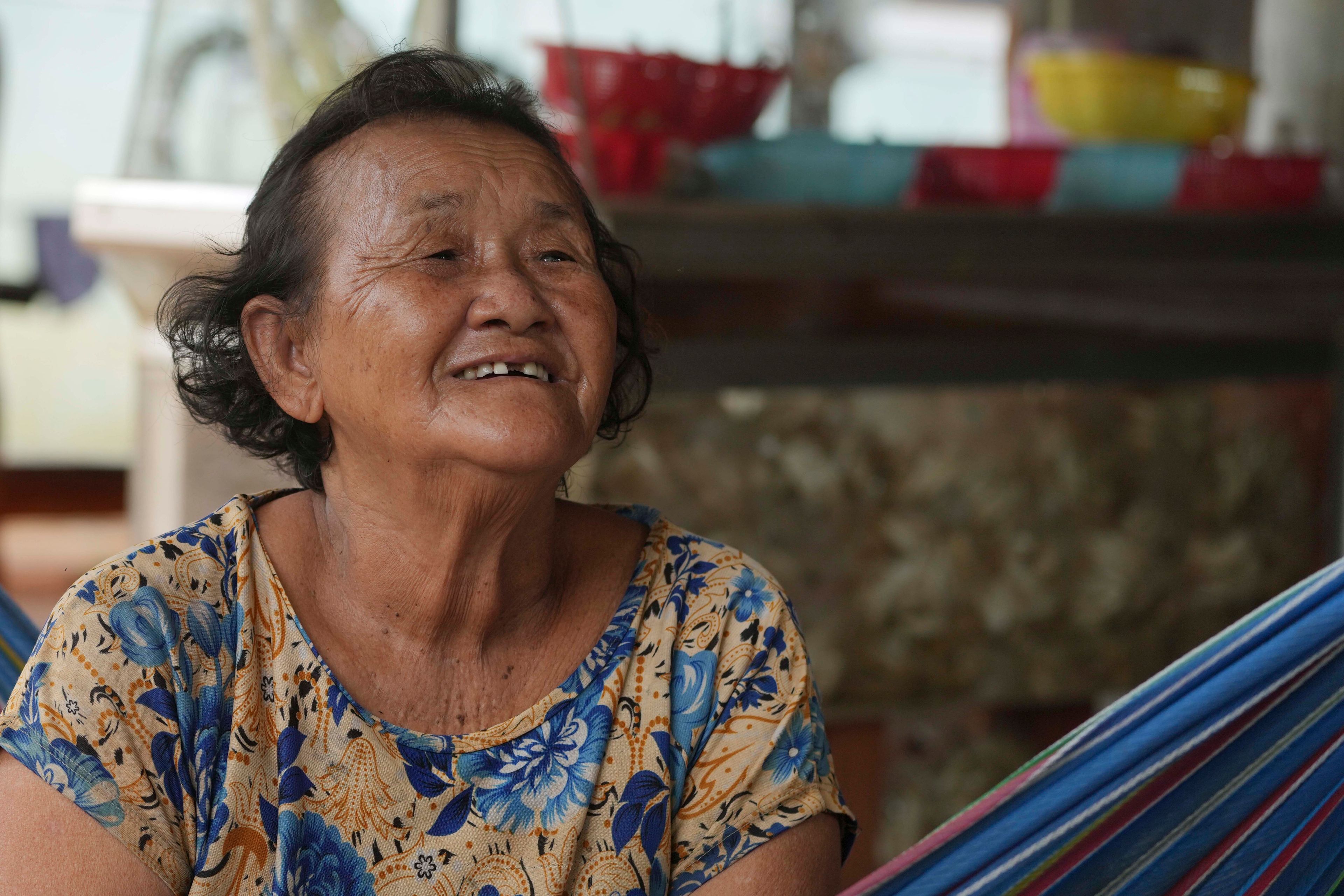 Crocodile farmer Ry Lean, 73, speaks with The Associated Press at her home in Siem Reap province, Cambodia, on Aug. 2, 2024. (AP Photo/Heng Sinith)