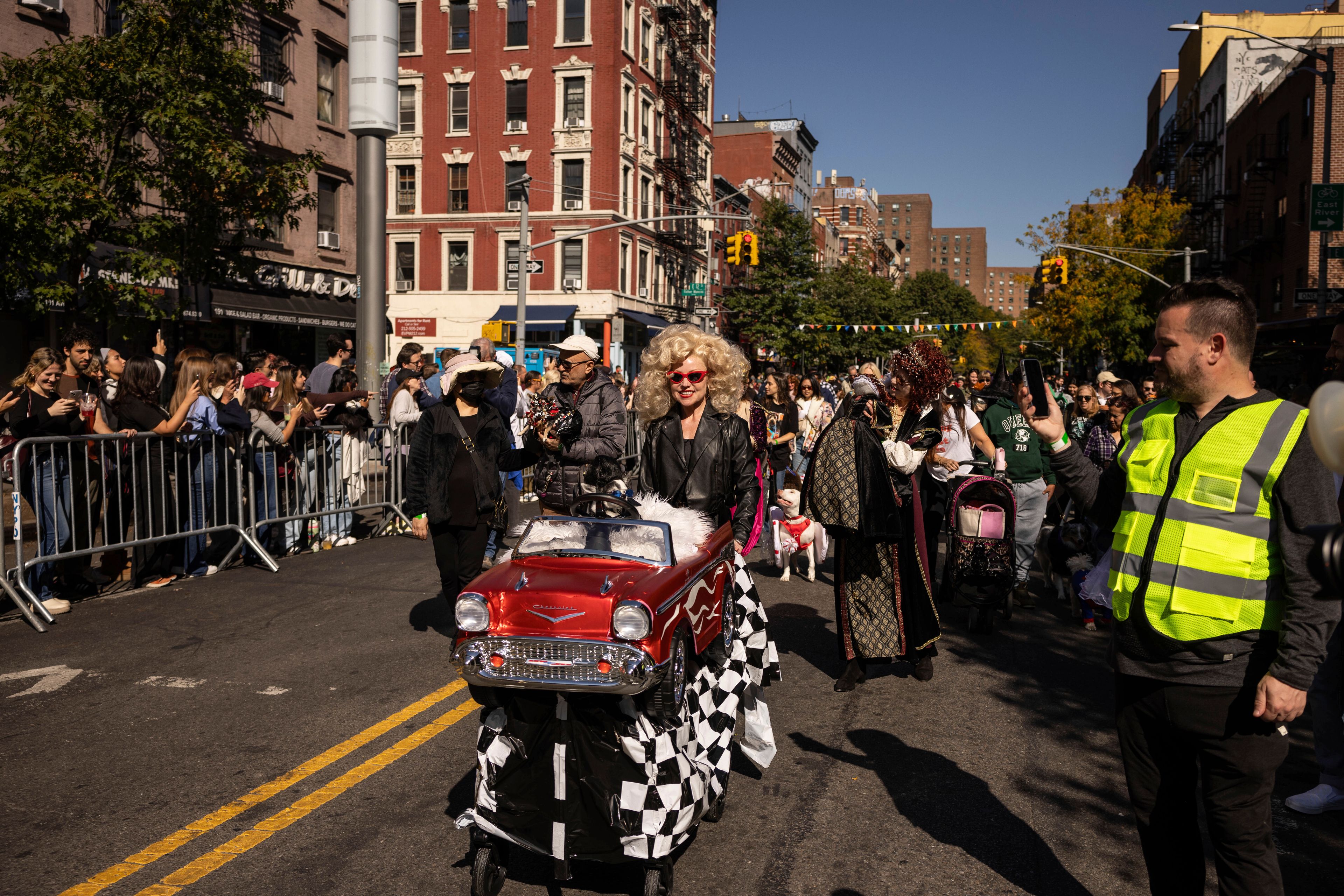 People and their dogs in costume participate in the 34th annual Tompkins Square Halloween Dog Parade, Saturday, Oct. 19, 2024, in New York. (AP Photo/Yuki Iwamura)