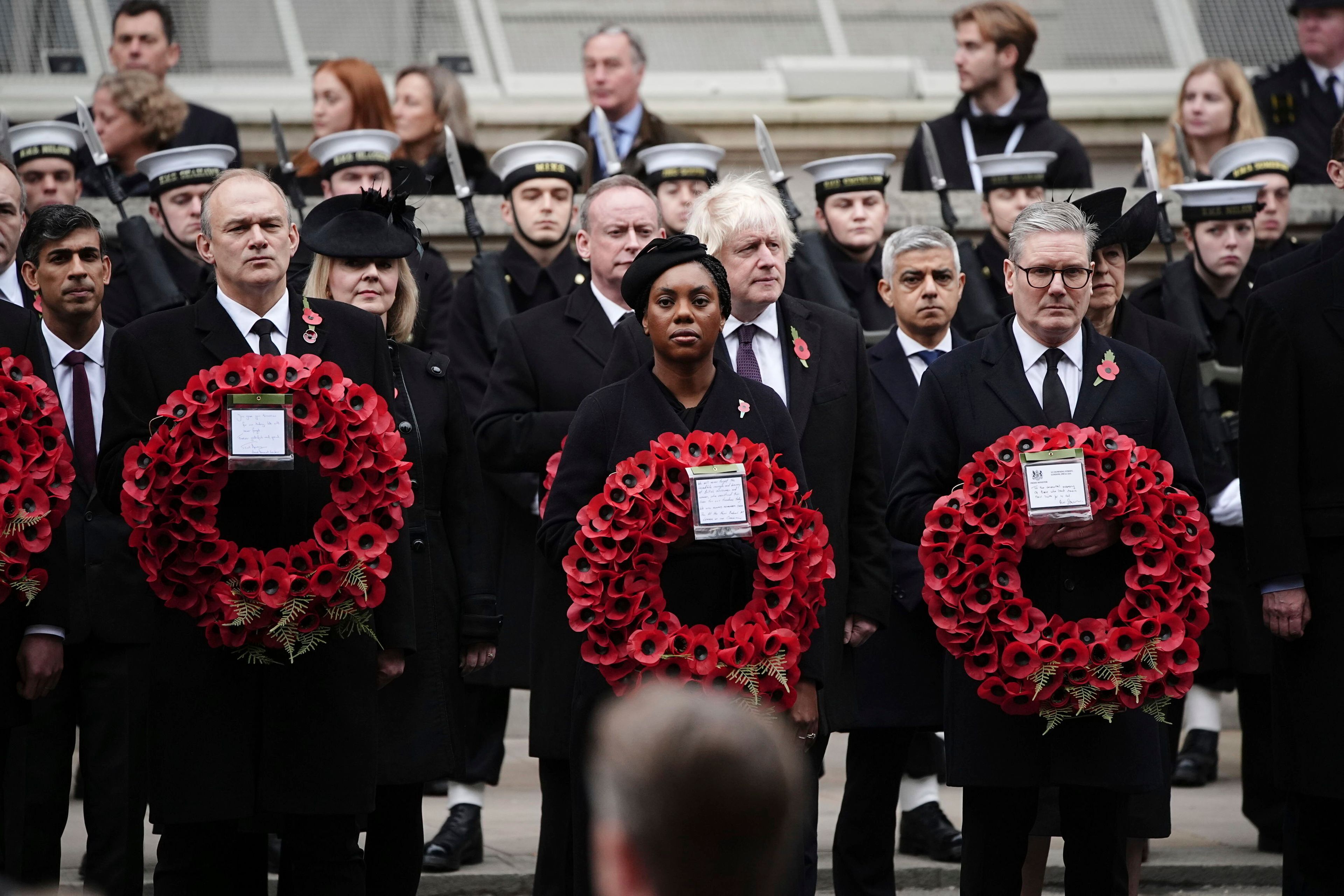 From left: Britain's former Prime Minister Rishi Sunak, Liberal Democrat leader Sir Ed Davey, former Prime Minister Liz Truss, leader of the opposition Kemi Badenoch, former Prime Minister Boris Johnson, Mayor of London Sadiq Khan and Prime Minister Sir Keir Starmer attend the National Service of Remembrance at The Cenotaph in London, England, Sunday, Nov. 10, 2024. (Aaron Chown/PA via AP)