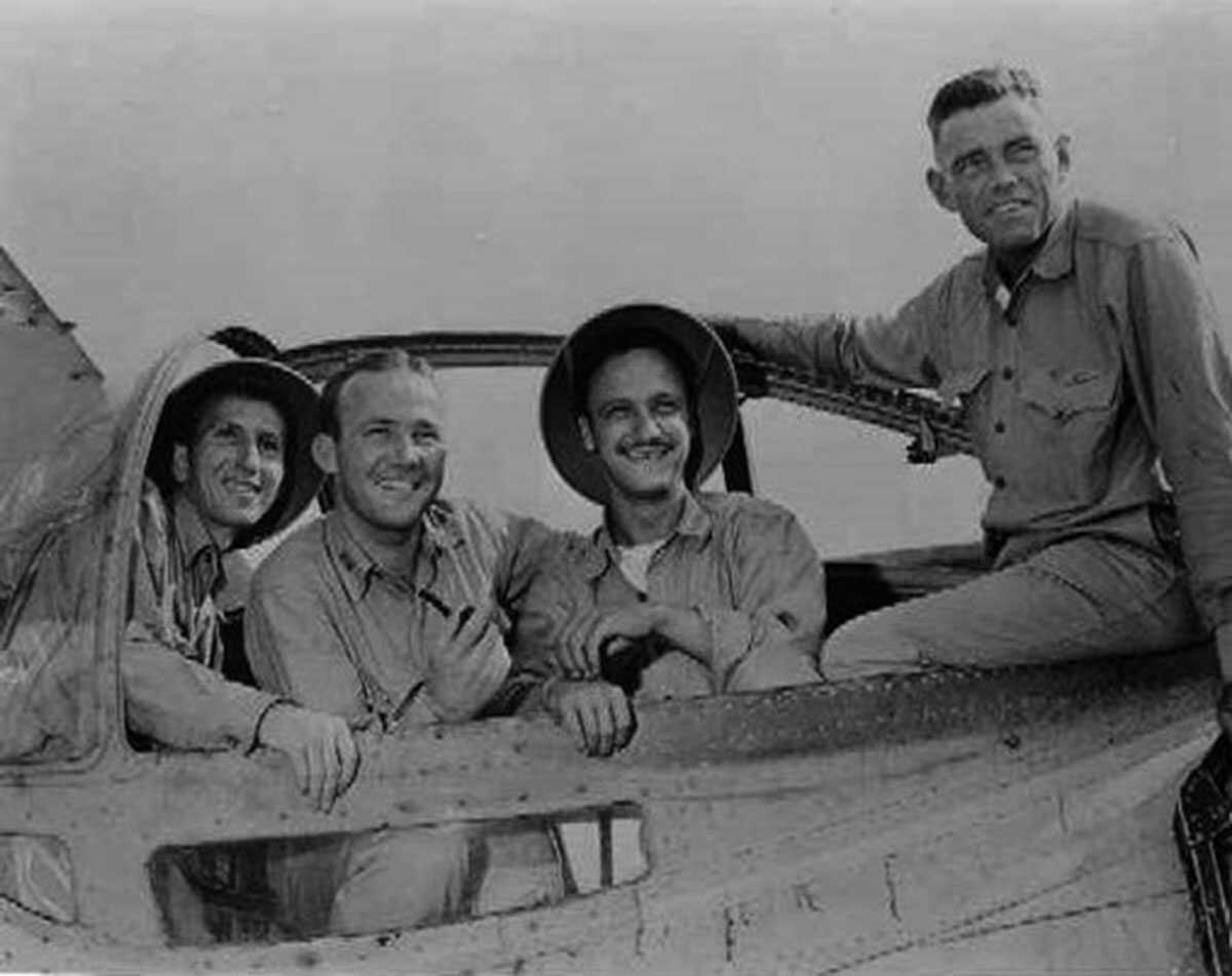 Crew members of the crashed B-17 after the ordeal. Left to right are John Bartek, William Cherry, John DeAngelis and James C. Whittaker. Courtesy of Auburn University Libraries Special Collections and Archives, Eddie V. Rickenbacker Collection.