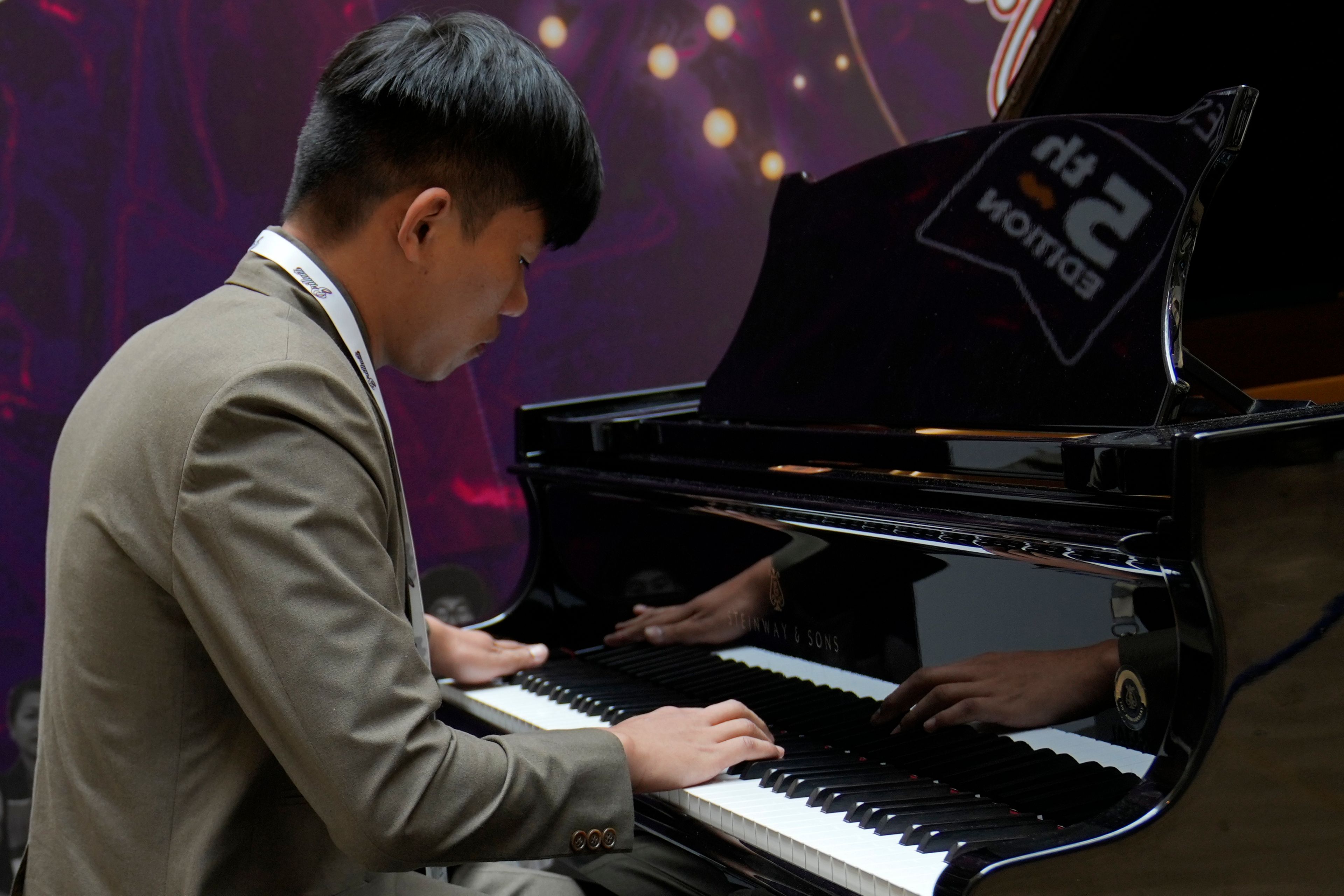 Takosangba Pongen, 27, a blind pianist, performs during the two-day Brillante Piano Festival in Bengaluru, India, Sunday, Sept. 29, 2024. (AP Photo/Aijaz Rahi)