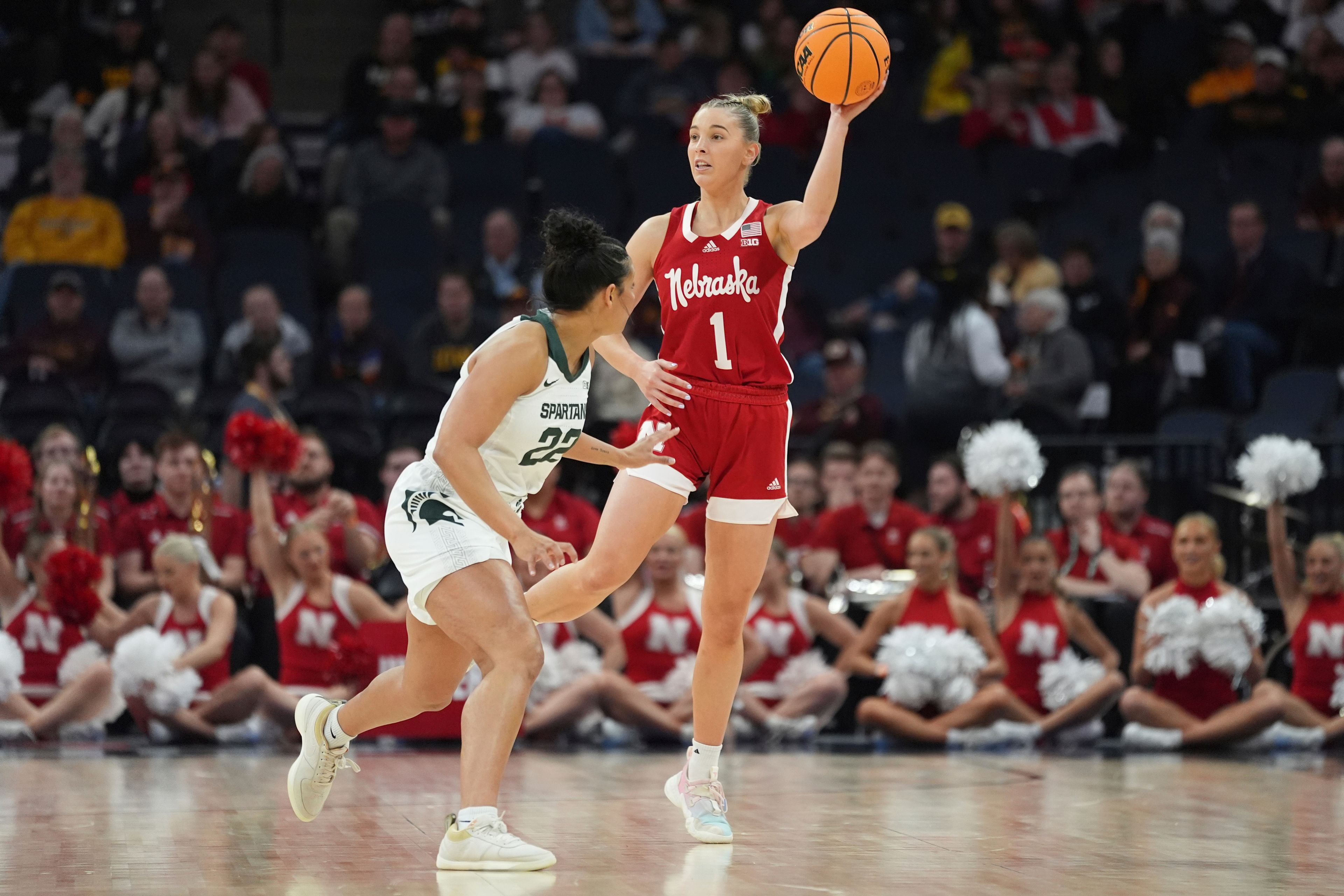 Nebraska guard Jaz Shelley (1) looks to pass as Michigan State guard Moira Joiner (22) defends during the first half of an NCAA college basketball game in the quarterfinals of the Big Ten women's tournament Friday, March 8, 2024, in Minneapolis. (AP Photo/Abbie Parr)