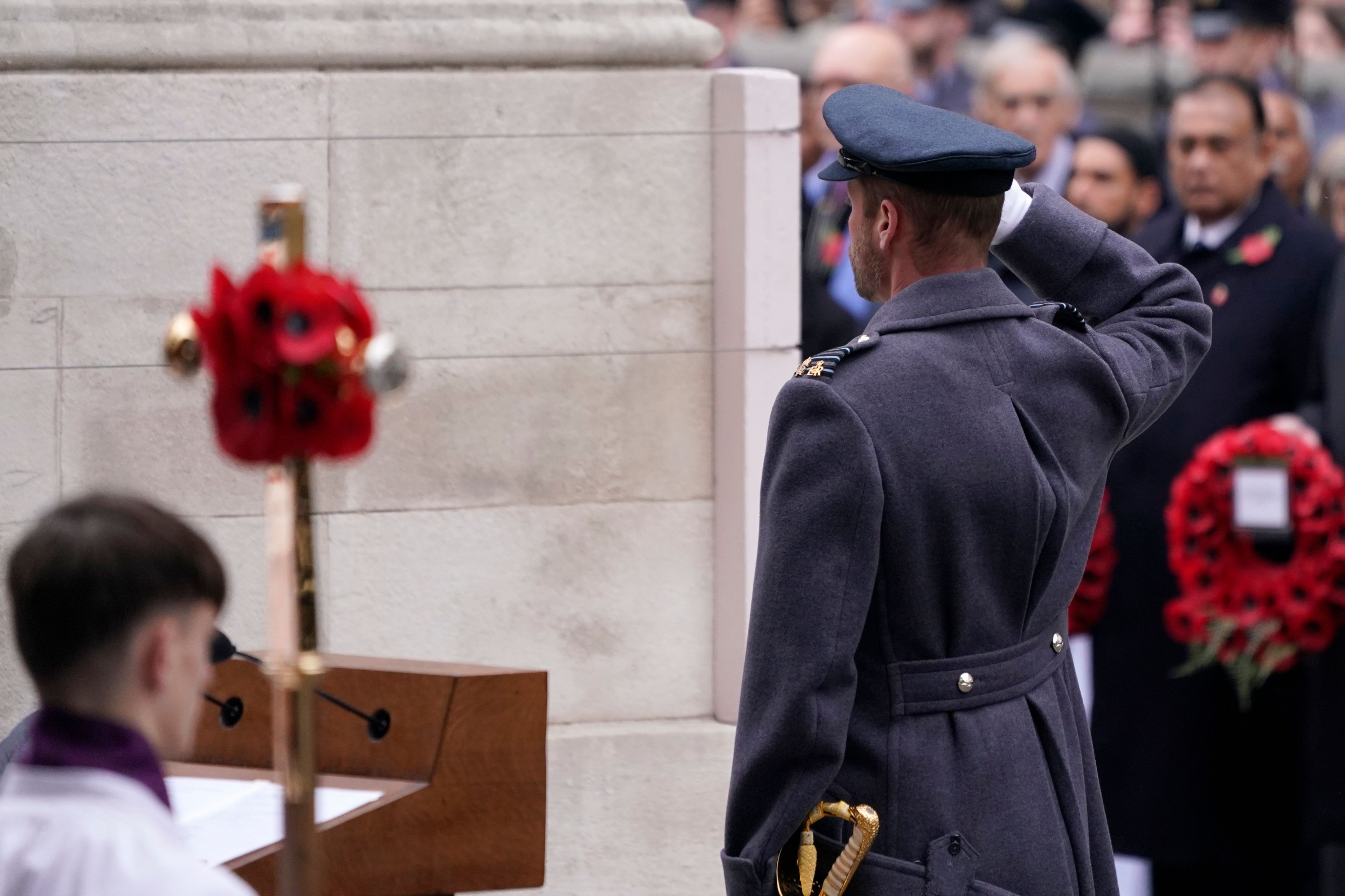 Britain's Prince William salutes after laying a wreath during the Remembrance Sunday Service at the Cenotaph in London, Sunday, Nov. 10, 2024. (AP Photo/Alberto Pezzali, Pool)