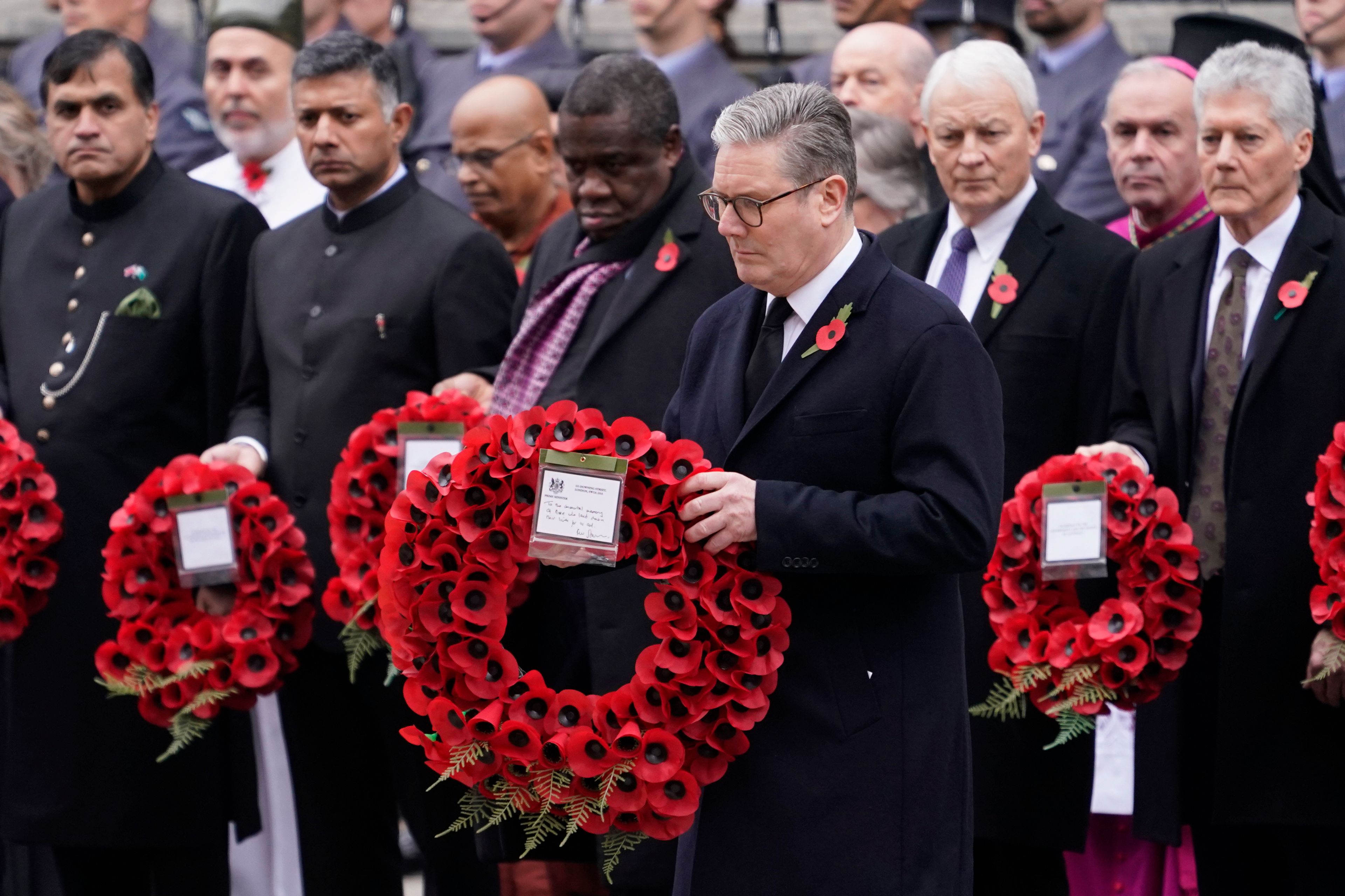 Britain's Prime Minister Keir Starmer lays a wreath during the Remembrance Sunday Service at the Cenotaph in London, Sunday, Nov. 10, 2024. (AP Photo/Alberto Pezzali)